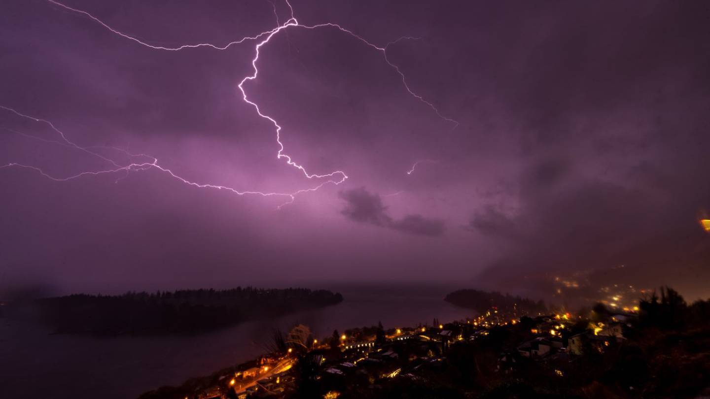 Lightning lit up the sky in Queenstown on Sunday night before the thunderstorm rolled up the South Island. Photo / James Allan