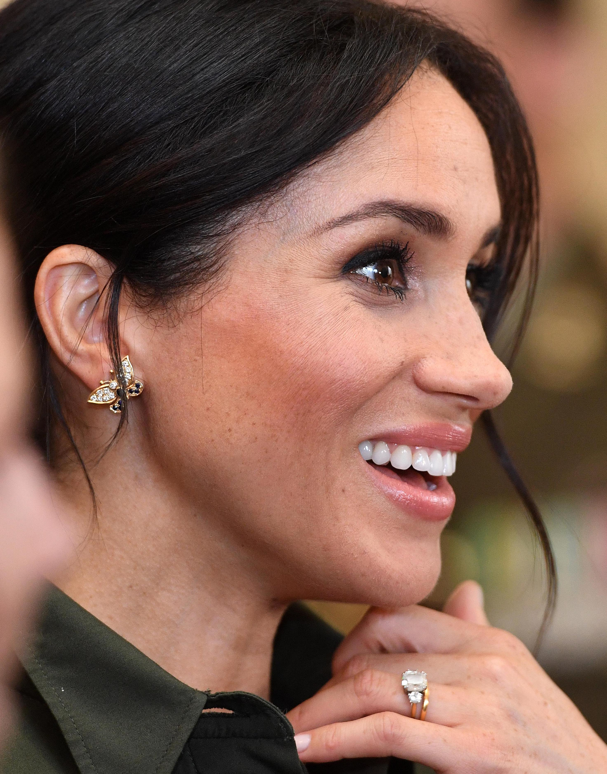 Meghan wearing a pair of butterfly earrings that had belonged to Princess Diana. Photo / Getty Images