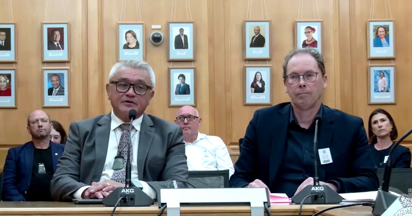RNZ chairman Jim Mather (left) and chief executive Paul Thompson appear before a Parliamentary select committee.