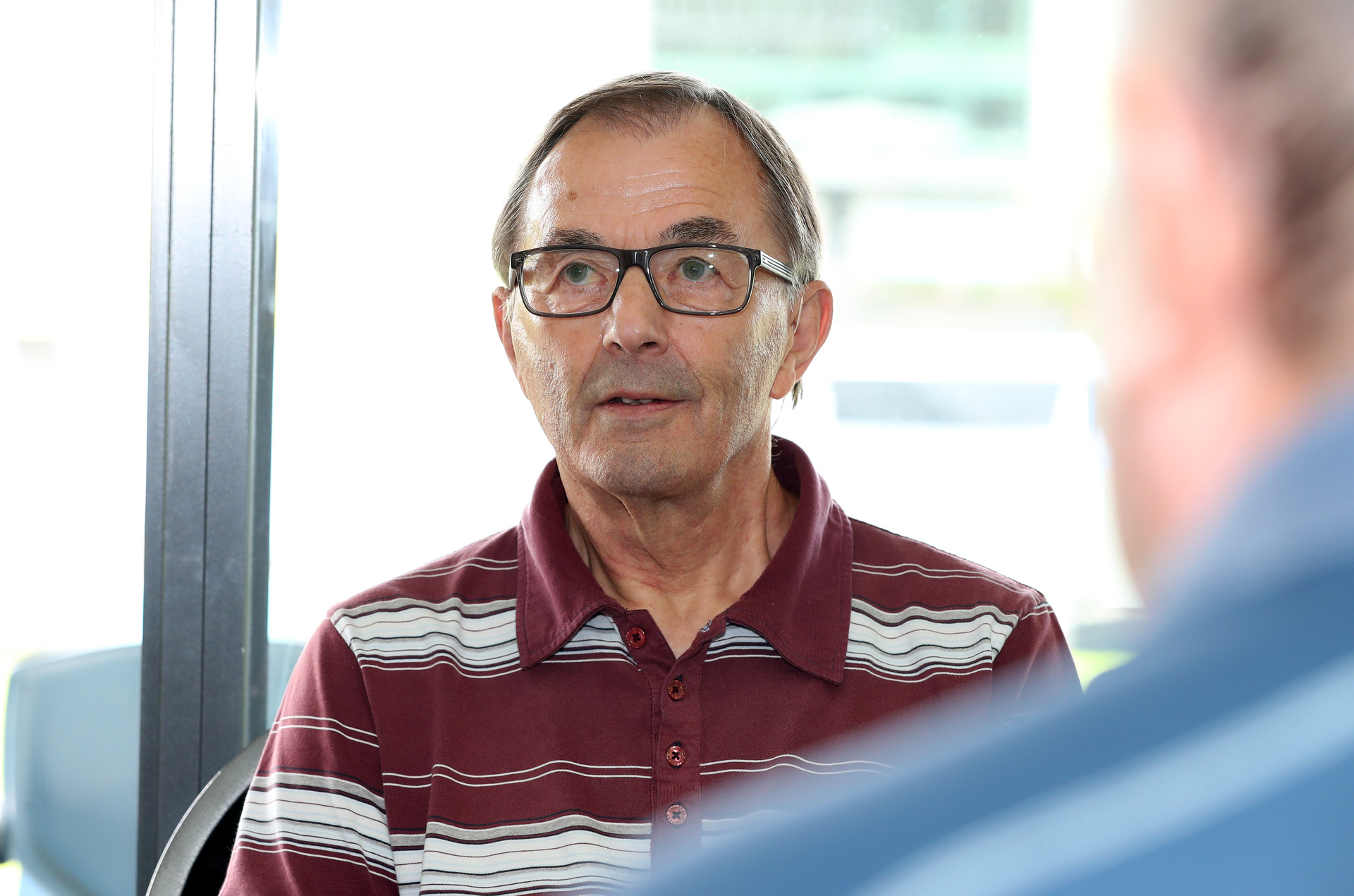 Roger Clarke of Parua Bay waiting to get his Covid vaccination at Semenoff Stadium.
Photo / Michael Cunningham 