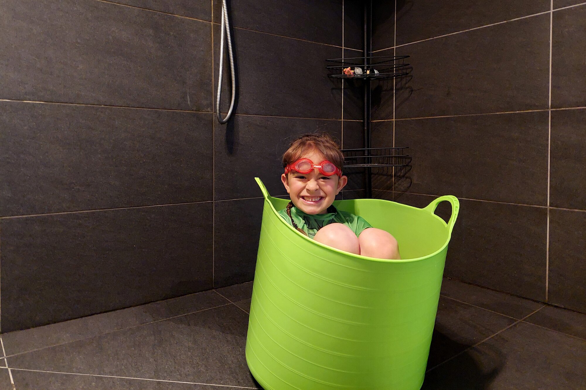 Youngster Harley says simple actions like reusing shower water outdoors can make all the difference with saving water. Photo / Kaipara District Council