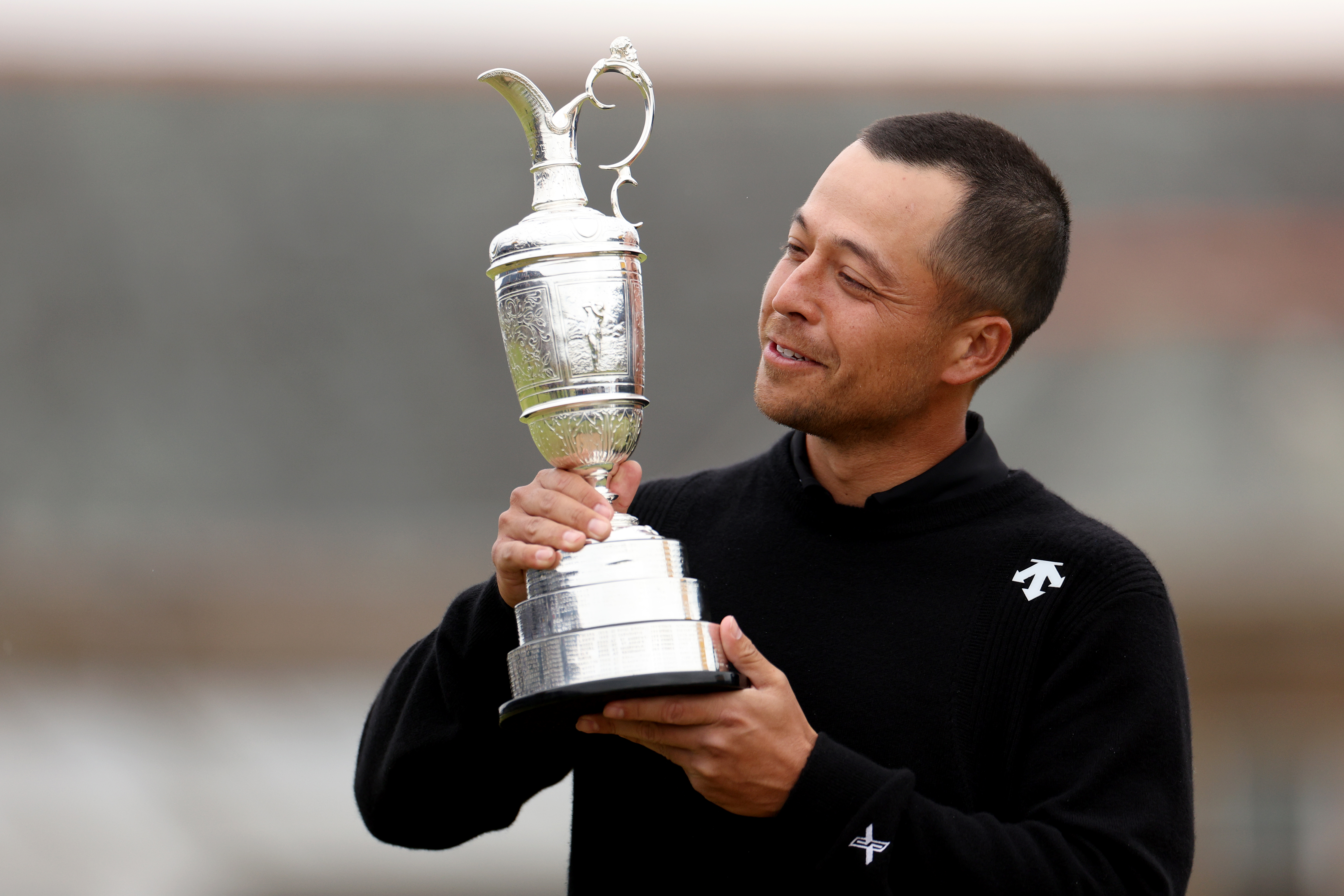 Xander Schauffele of the United States poses with the Claret Jug on the 18th hole in celebration of victory during day four of The 152nd Open championship. Photo / Getty Images