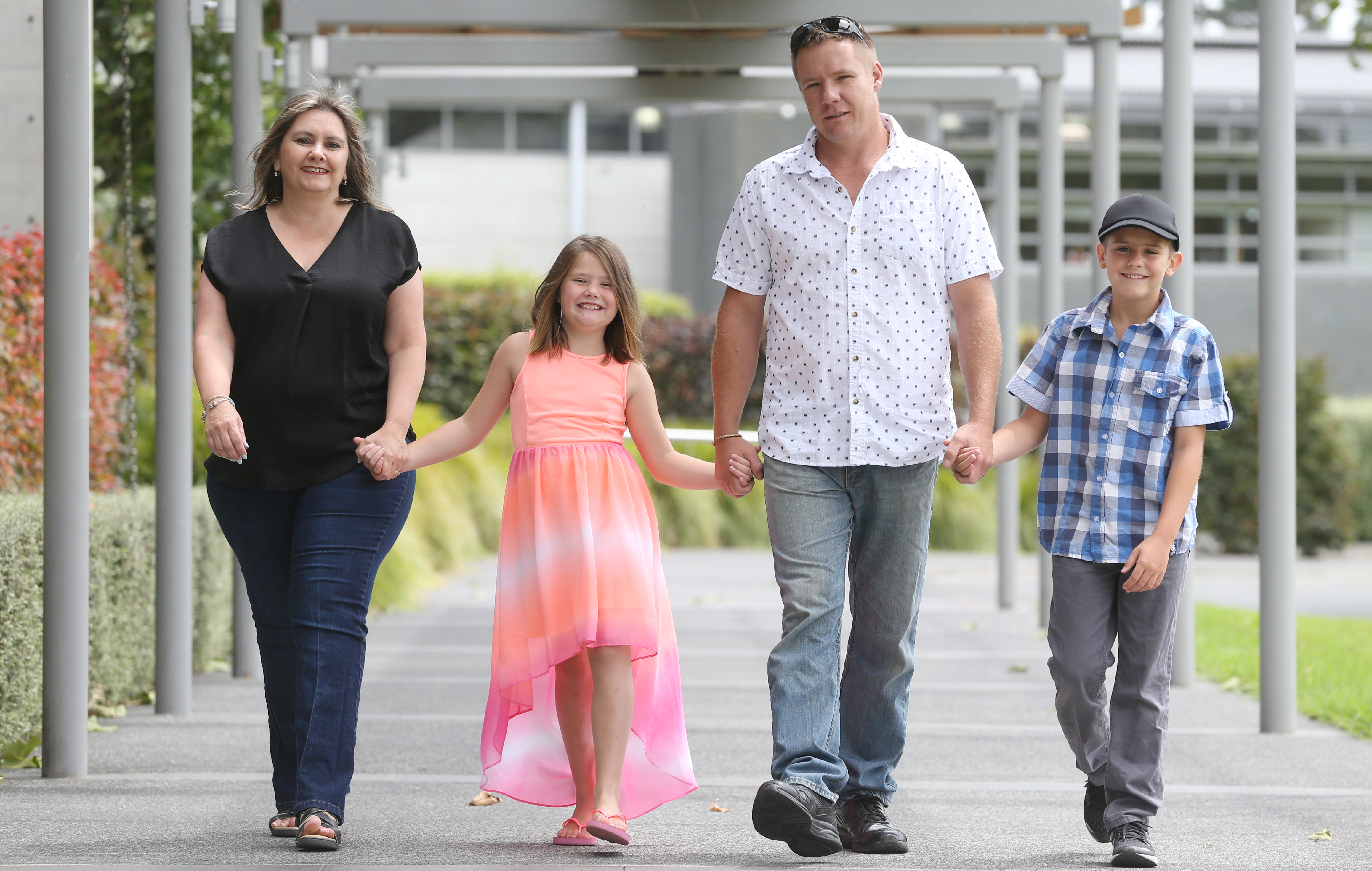 Conifer Grove School pupils Megan, second-left, and Ryan Kennedy, right, pictured with parents Amanda and Colin Kennedy, avoid travel costs by biking to school. Photo / Doug Sherring