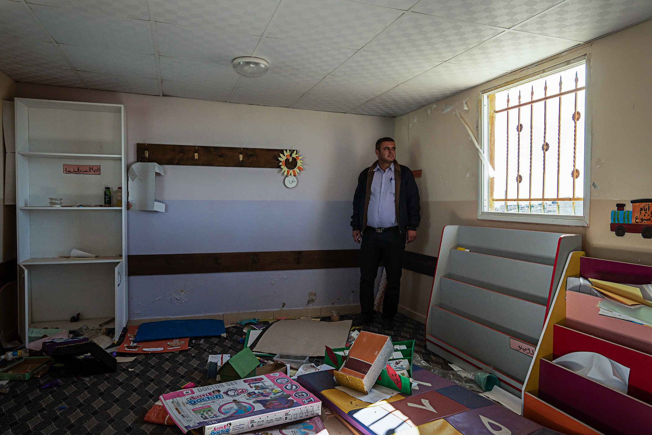 Fayez Til, the village head of Khirbet Zanuta, in a schoolroom demolished by Israeli settlers. Photo / Samar Hazboun for The New York Times