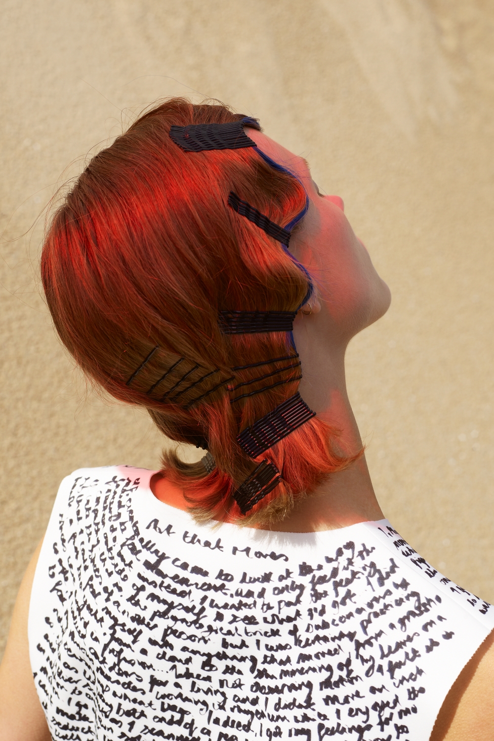 Len's Manifesto 'Art That Moves' handwritten on a dress. Photo / Vivianne Sassen