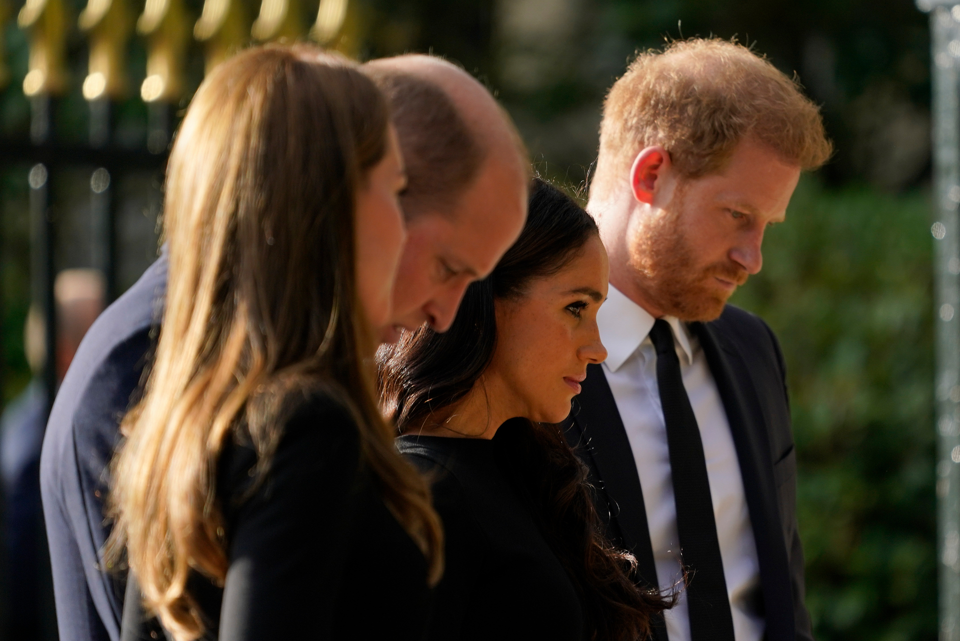 Prince William and Kate, Princess of Wales, left, and Britain's Prince Harry and Meghan, Duchess of Sussex view the floral tributes for the late Queen Elizabeth. Photo / AP