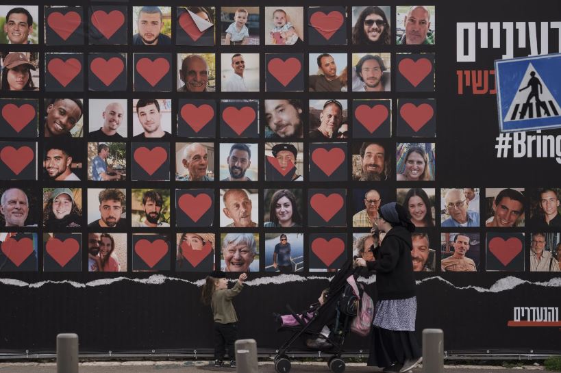 A wall in Jerusalem bearing the photographs of hostages who were kidnapped during the Hamas attack on Israel on October 7. Photo / AP 