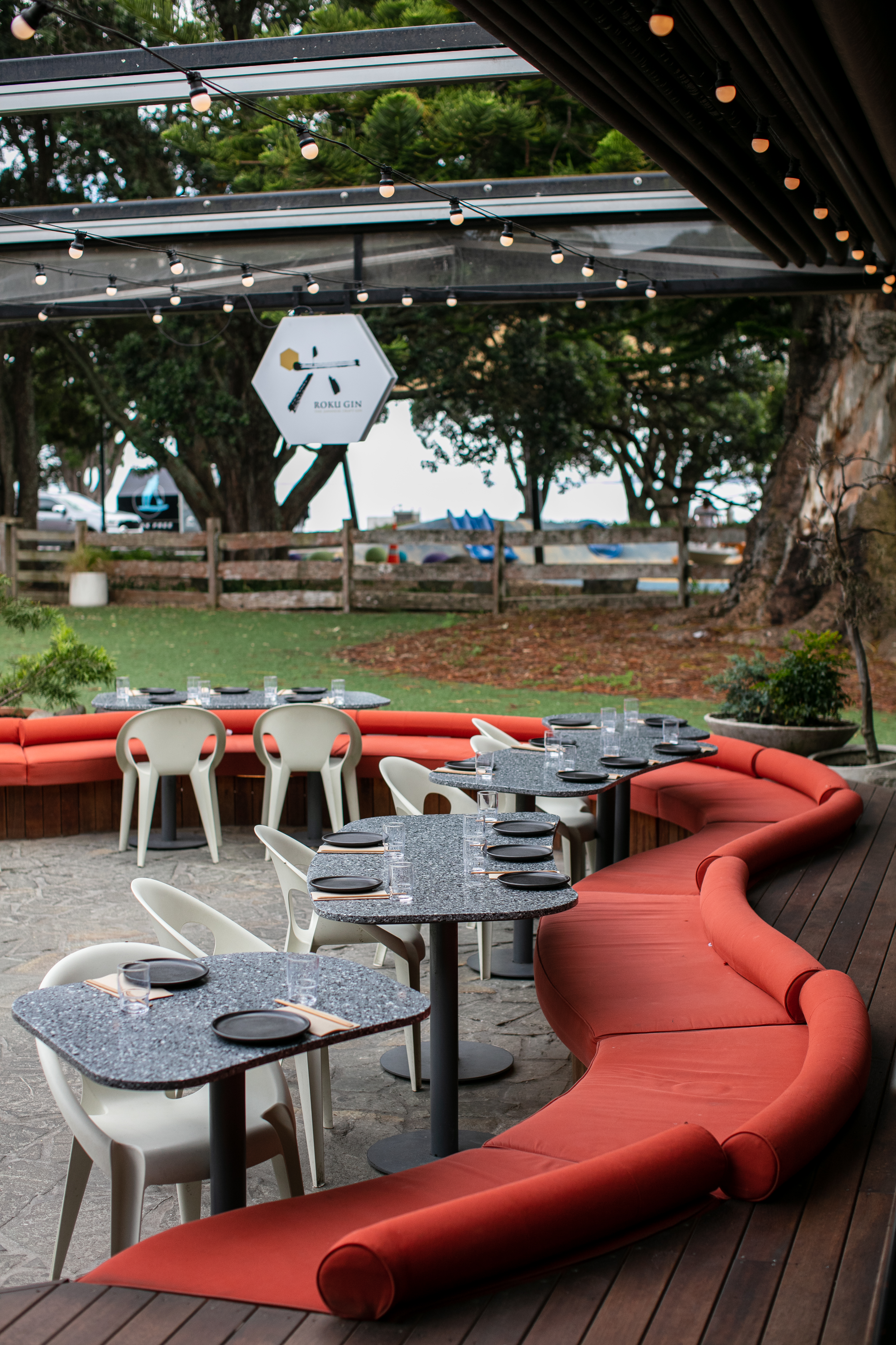 The view from the outdoor dining area integrates the nearby park. Photo / Babiche Martens