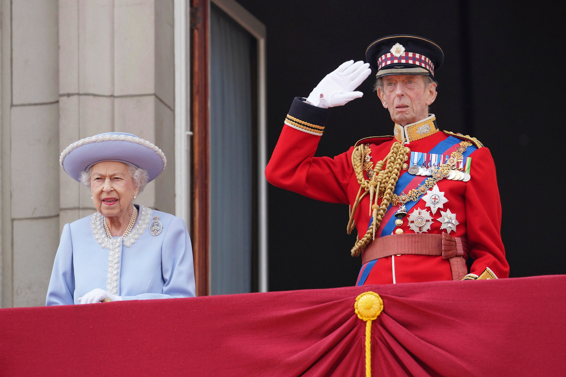 Queen Elizabeth II and the Duke of Kent watch from the balcony of Buckingham Palace. Photo / AP