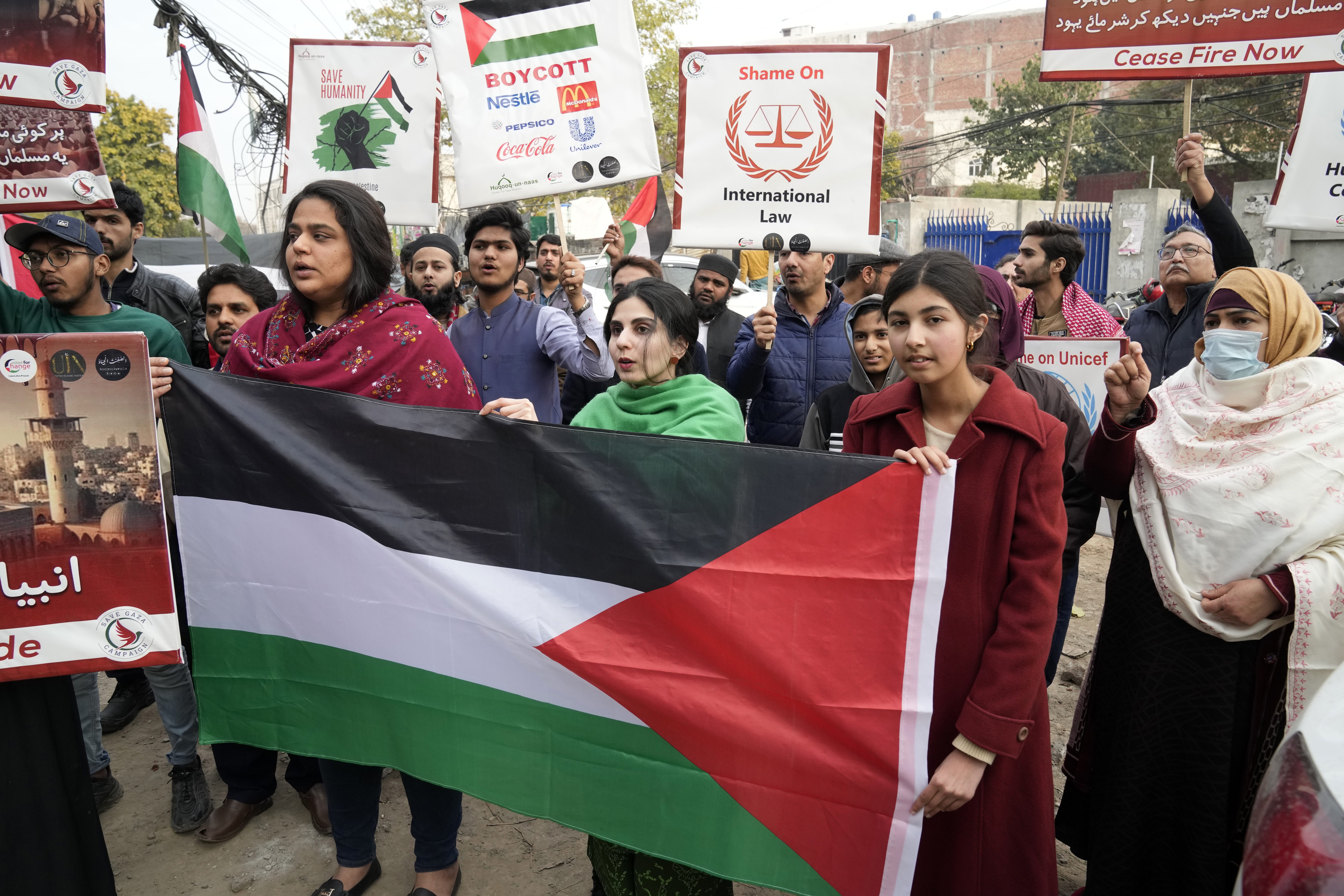 Pakistani protesters hold placards during a protest against Israeli airstrikes and to show solidarity with Palestinian people in Gaza, in Lahore, Pakistan. Photo / AP