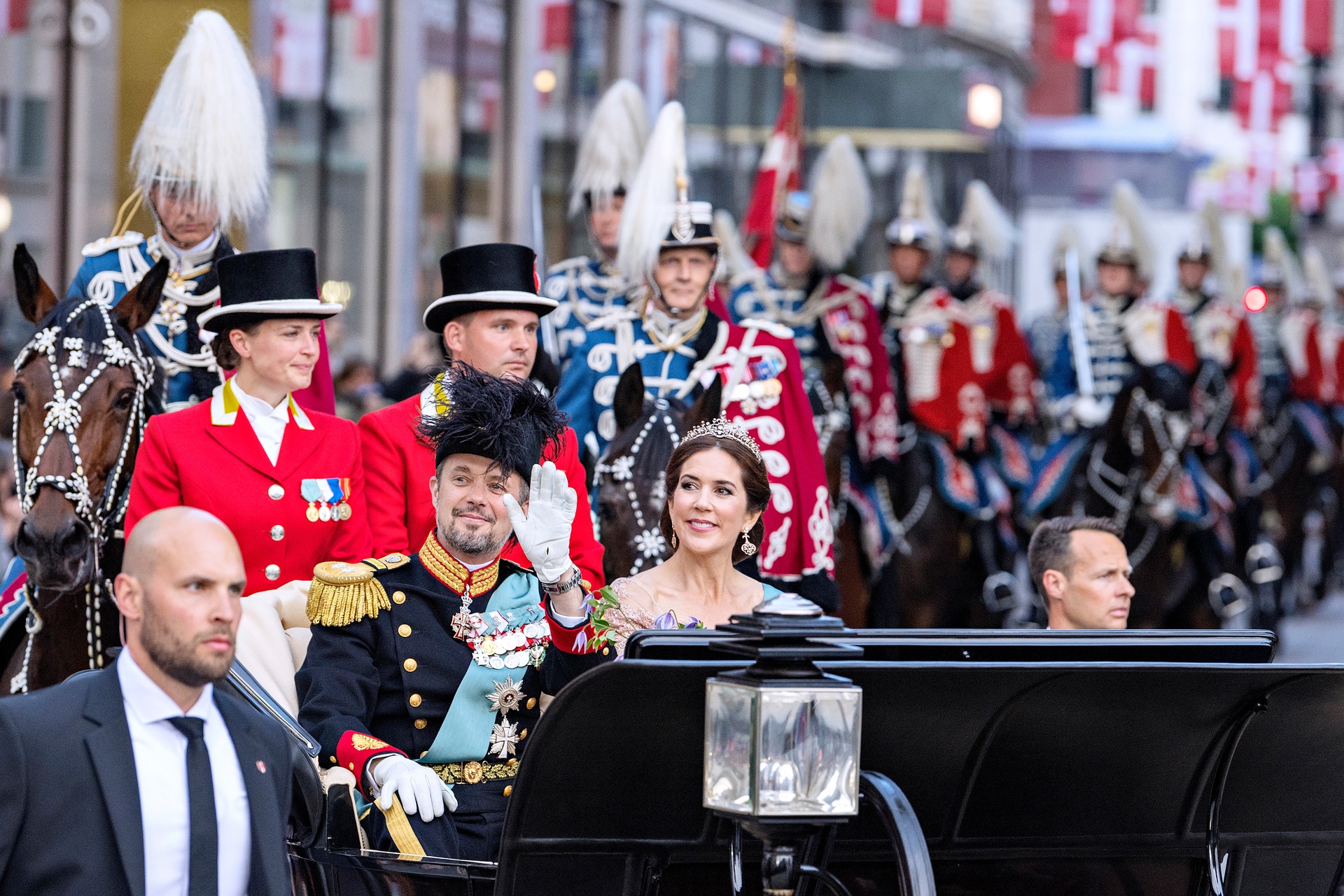 Prince Frederik and Princess Mary ride a horse-drawn carriage from Amalienborg Castle to Christiansborg Castle as he celebrates his 50th. Photo / AP