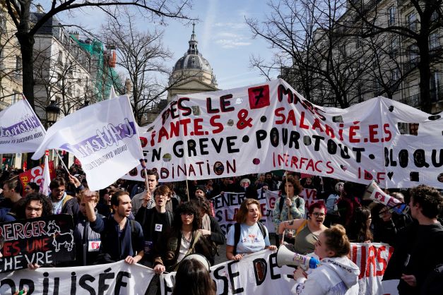 Students shout slogans during a demonstration against the government's plan to raise the retirement age to 64 in Paris on  Thursday. Photo / AP 