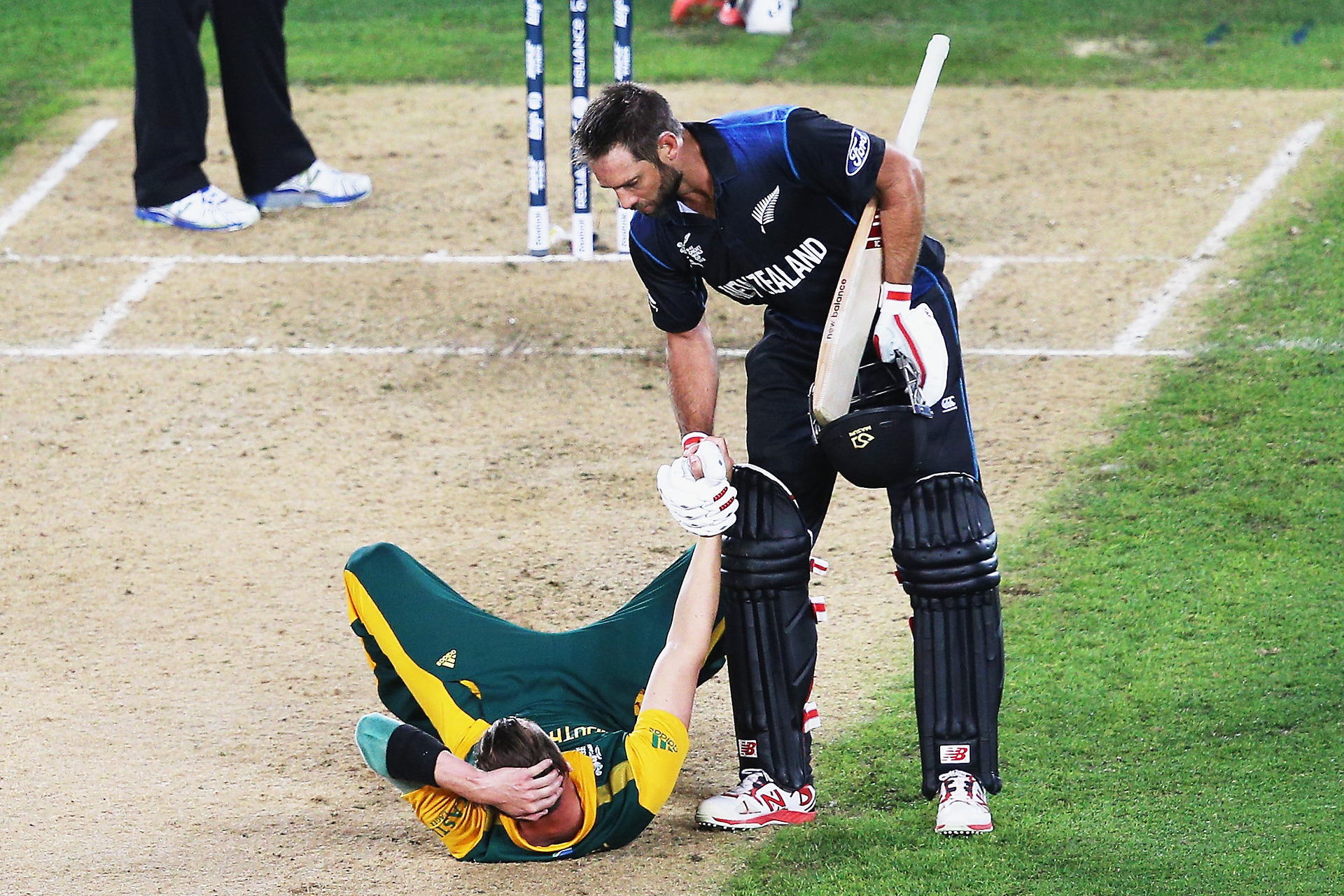 Grant Elliott reaching out to a stricken Dale Steyn would become the lasting image of the 2015 Cricket World Cup. Photo / Getty