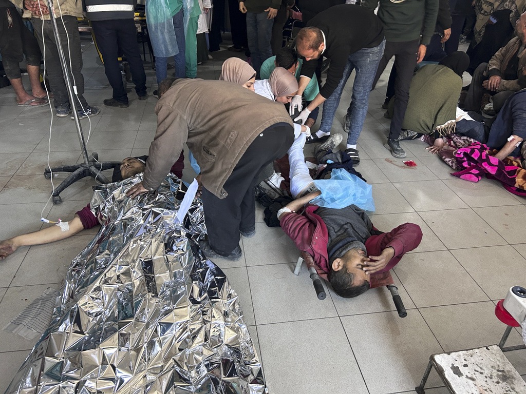 Palestinians wounded in an Israeli strike while waiting for humanitarian aid are treated in Shifa Hospital. Photo / AP