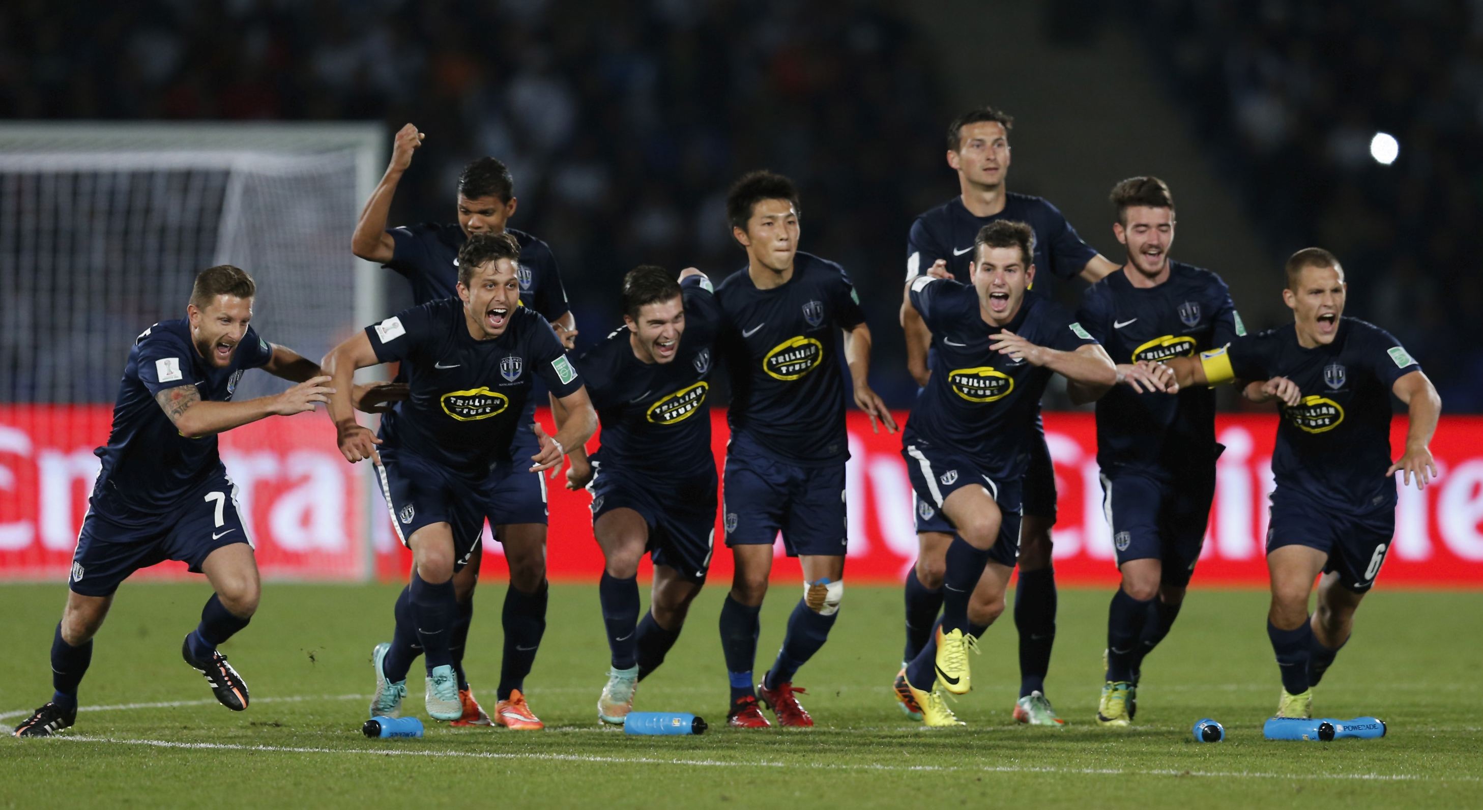 Auckland City players celebrate their victory over Cruz Azul in the third-place playoff game at the FIFA Club World Cup. Photo / Getty Images 