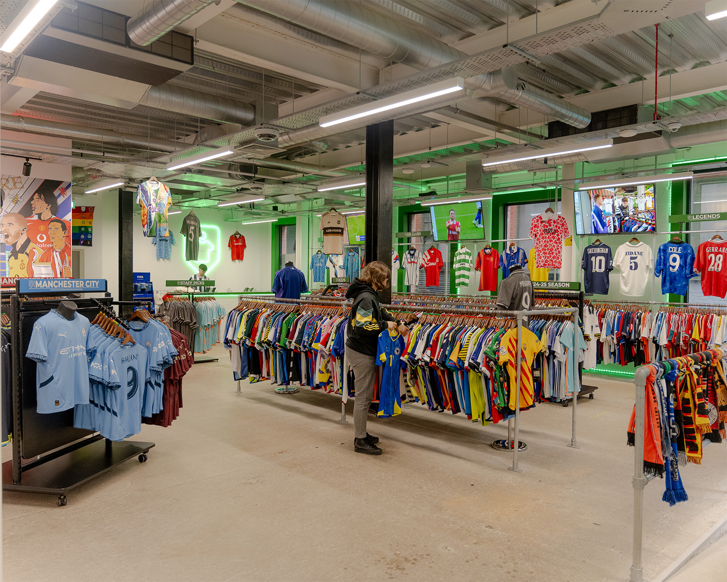 Shoppers visit the Classic Football Shirts store in Manchester England. Photo / Jack Roe for The New York Times