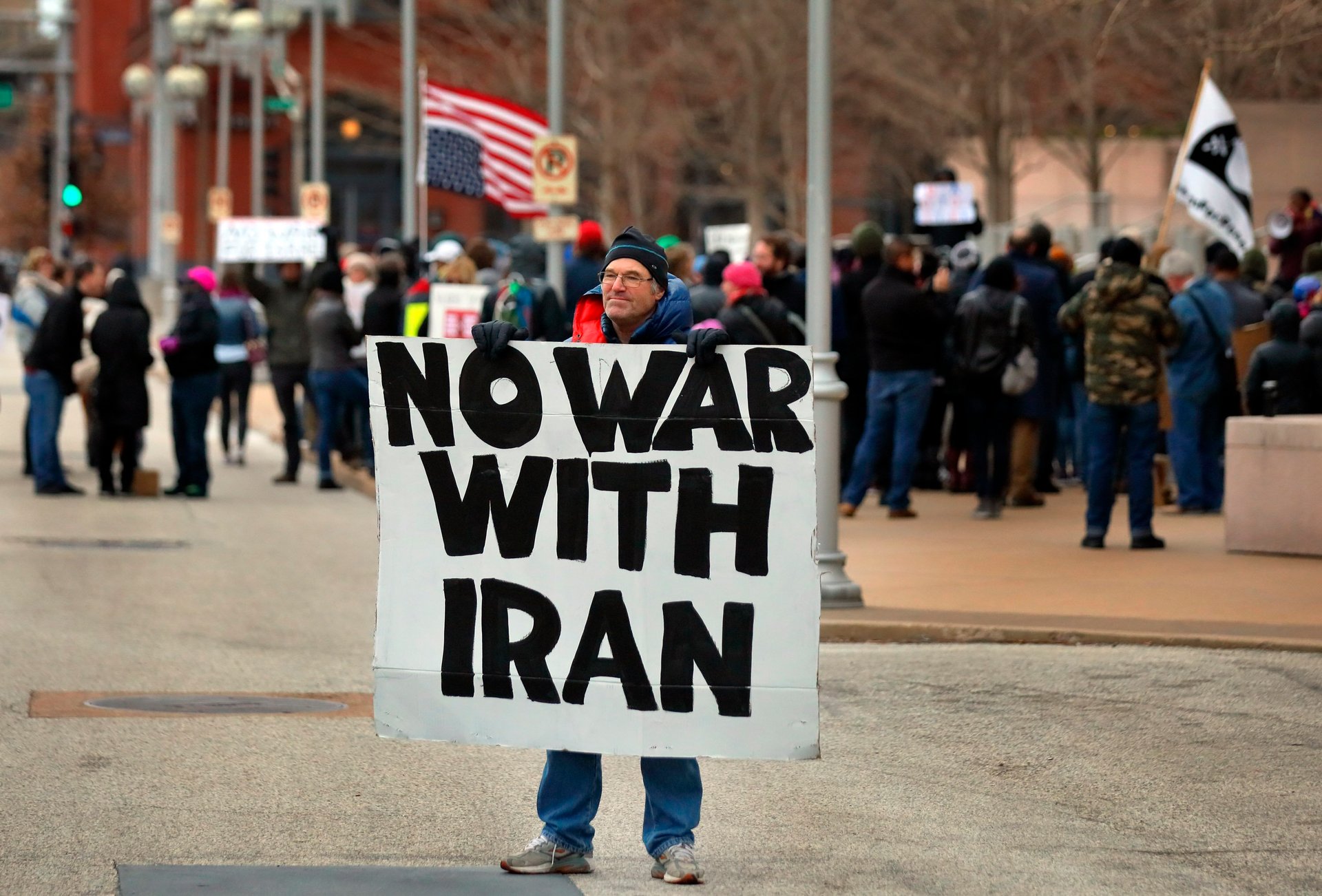 Air Force veteran Mike Fitzgerald, centre, from Kirkwood, Mo., stands near a protest outside the Federal Courthouse . Photo / AP