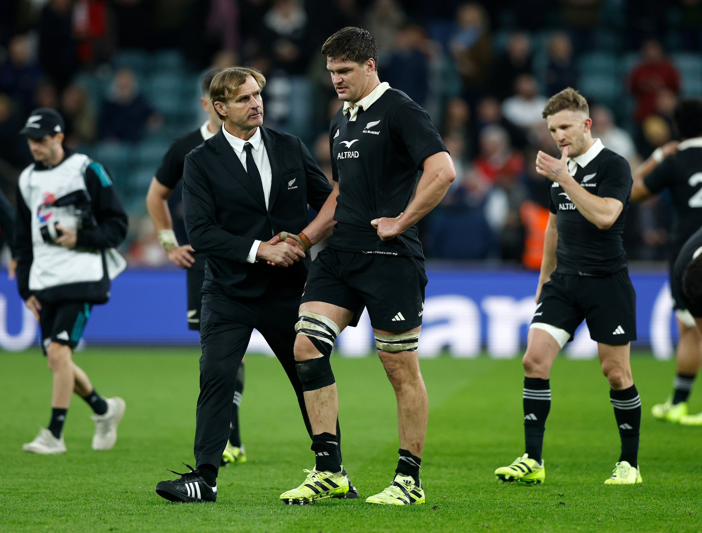 All Blacks head coach Scott Robertson and skipper Scott Barrett shake hands following the defeat to England at Twickenham. Photo / Photosport