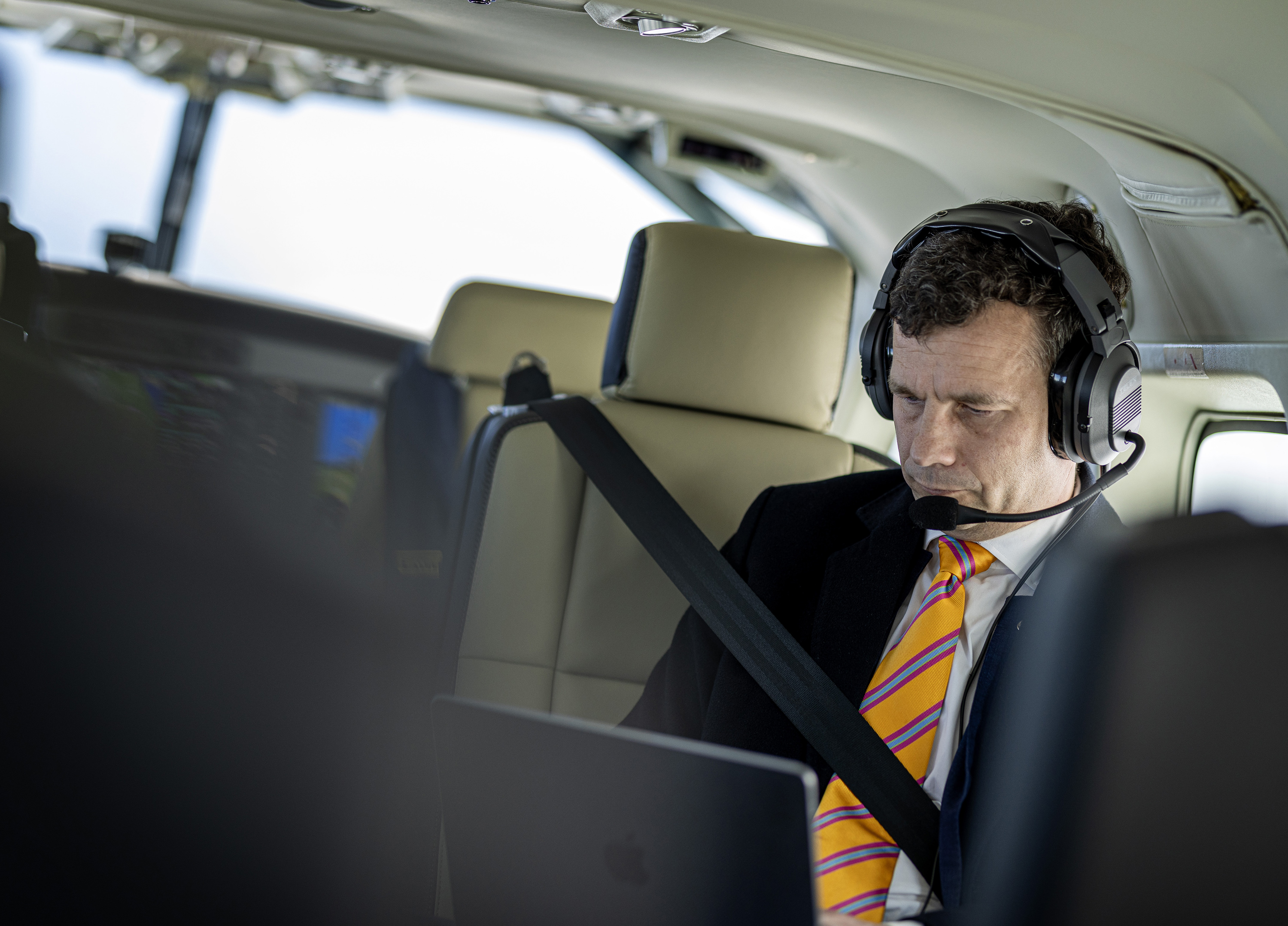 David Seymour working on the plane between campaign events. Photo / Mike Scott.