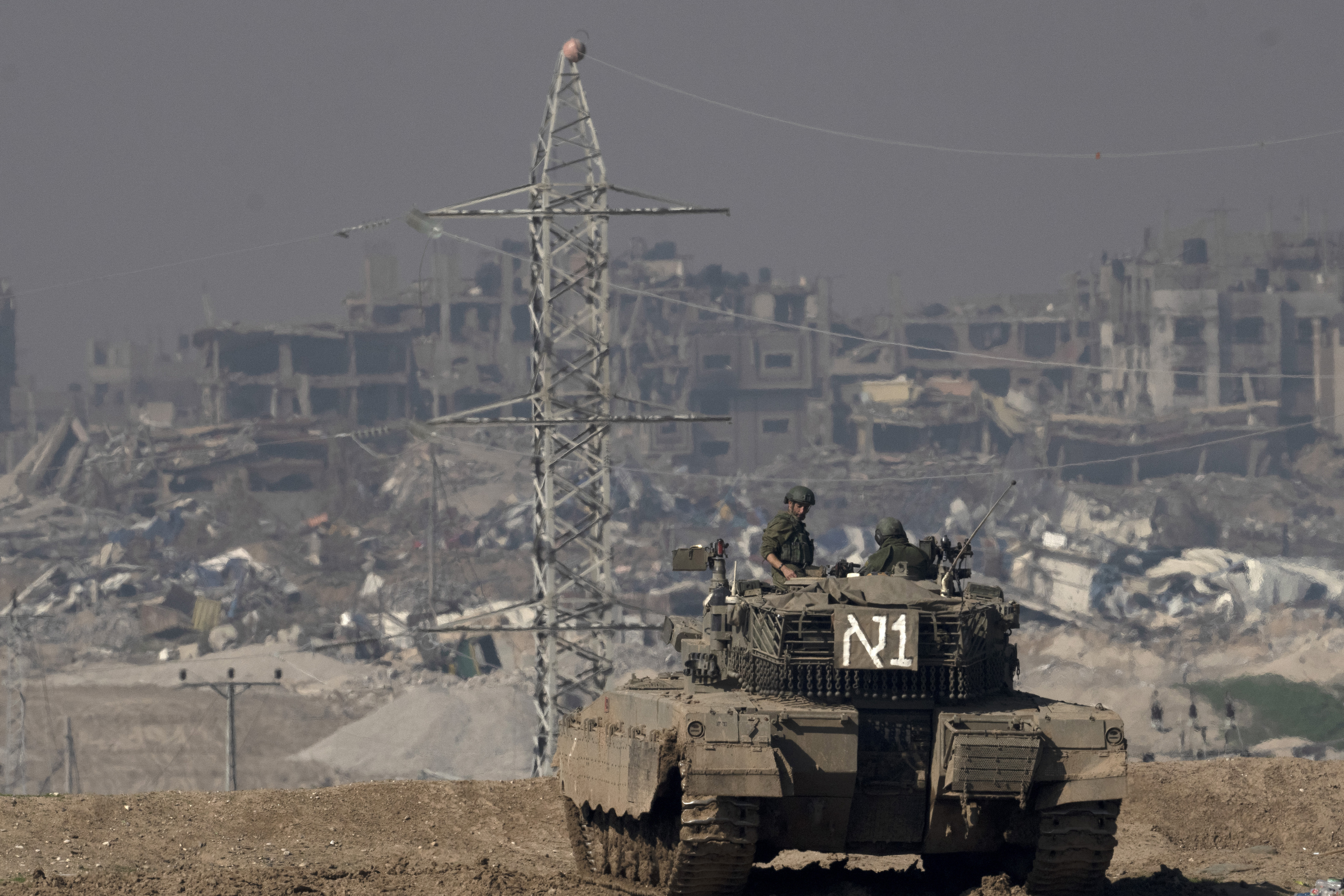 Israeli soldiers overlook the Gaza Strip from a tank, as seen from southern Israel, Friday, January 19, 2024. Photo / AP
