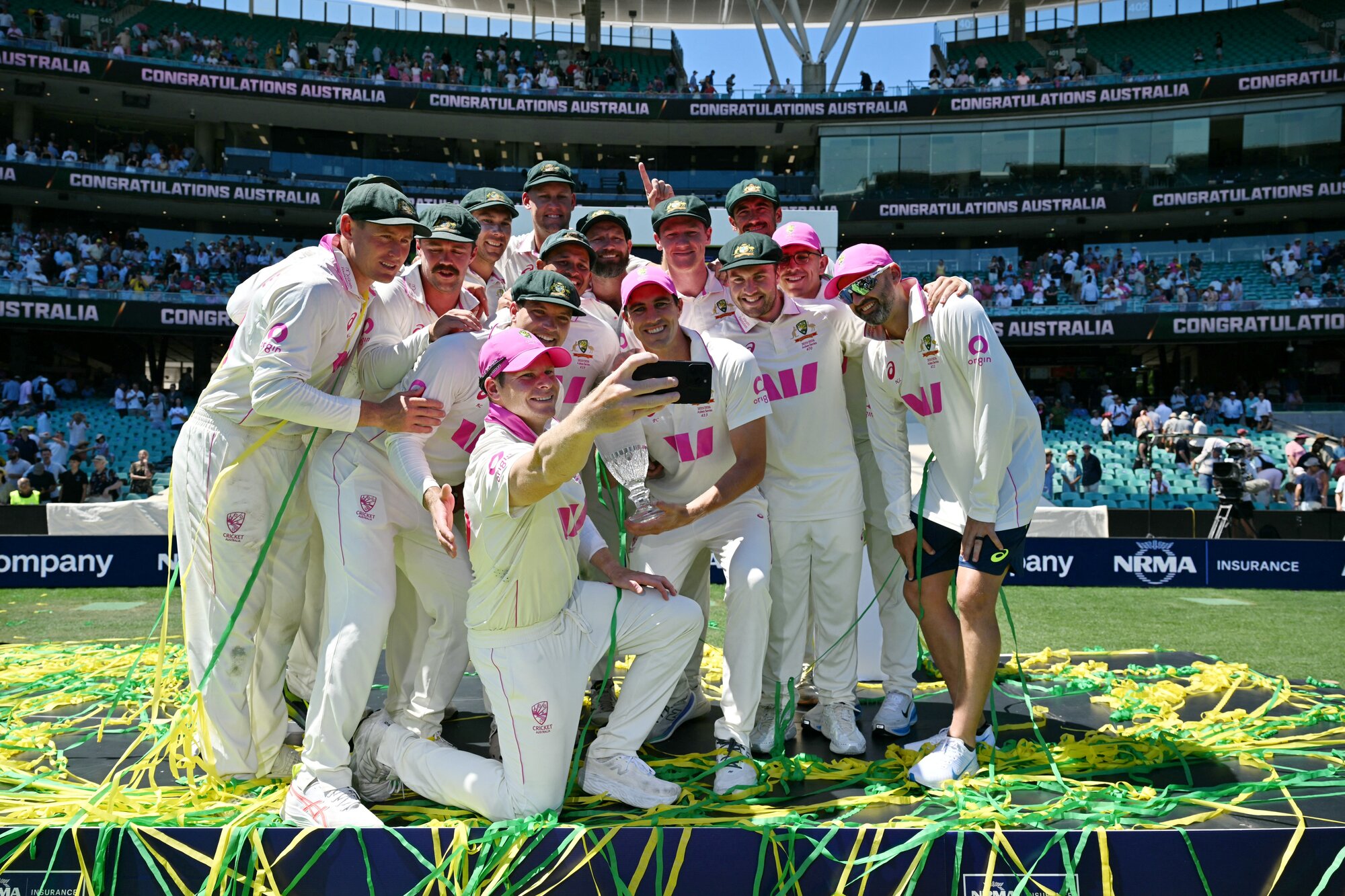 Australian players celebrate after winning the fifth Ashes test to take the series over England 4-1. Photo / AFP 