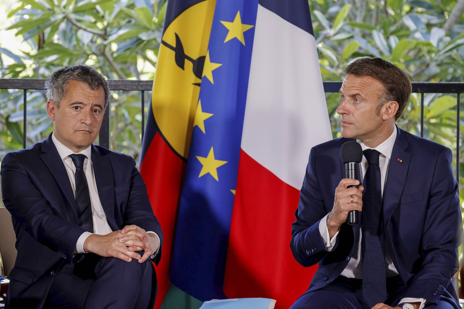 Macron speaks as sits next to France's Minister for Interior and Overseas Gerald Darmanin during a meeting with New Caledonia's elected officials at the French High Commissioner Louis Le Franc's residence in Noumea. Photo / AP