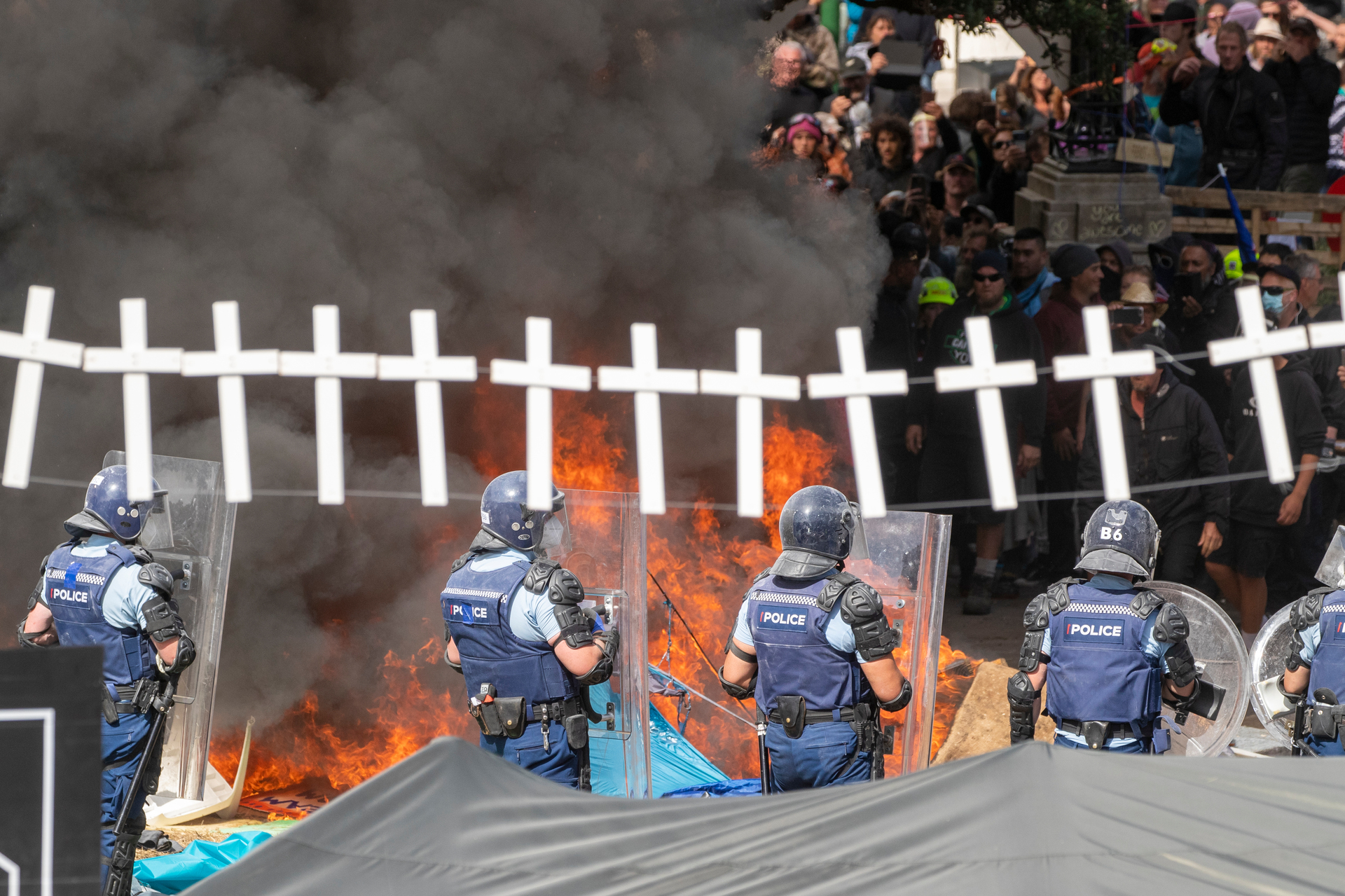 Smoke billows from burning tents as the protest at Parliament descends into anarchy. Photo / Mark Mitchell
