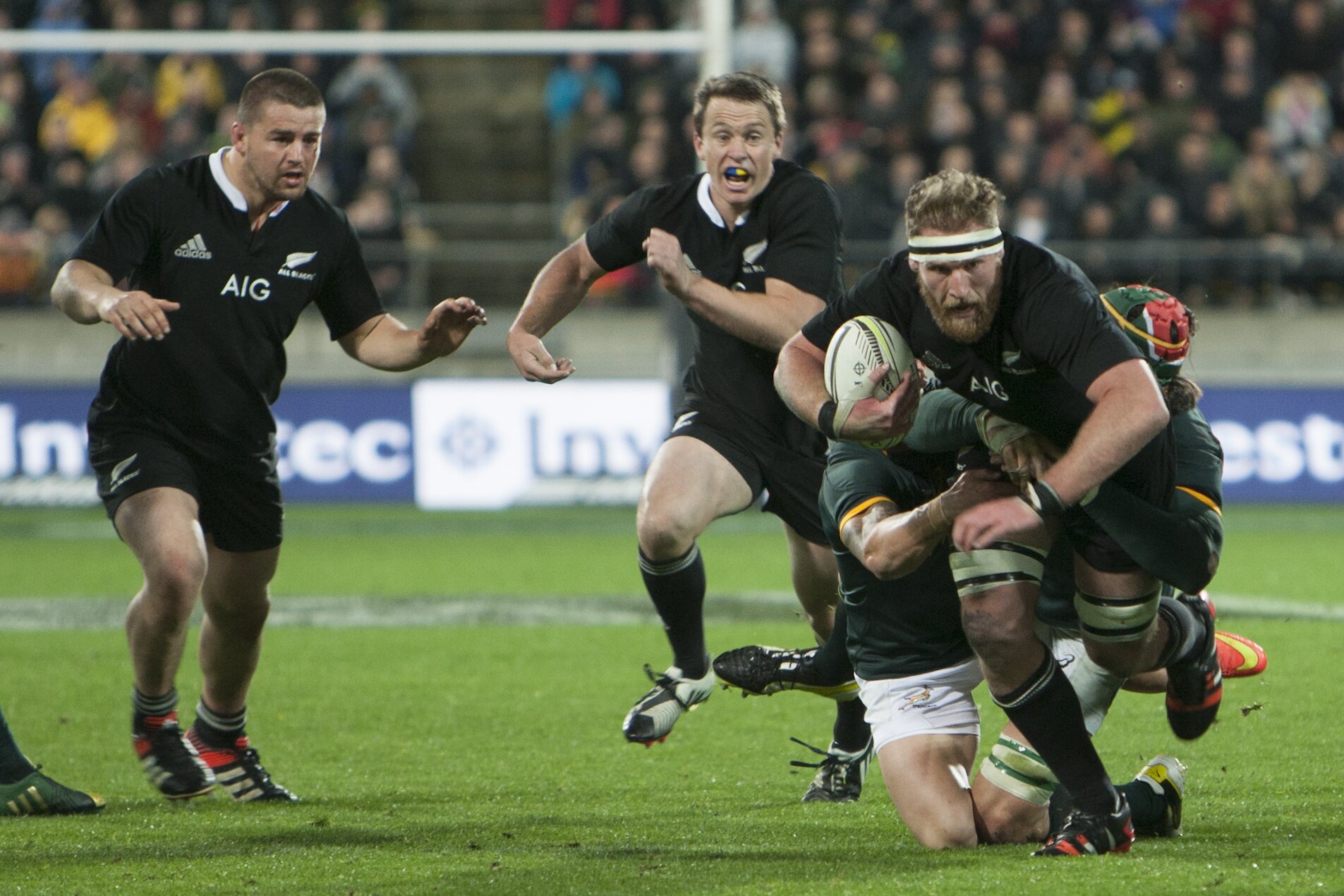 All Blacks captain Kieran Reid charges on as Dane Coles and Ben Smith run in support. Photo / Darren Taumata