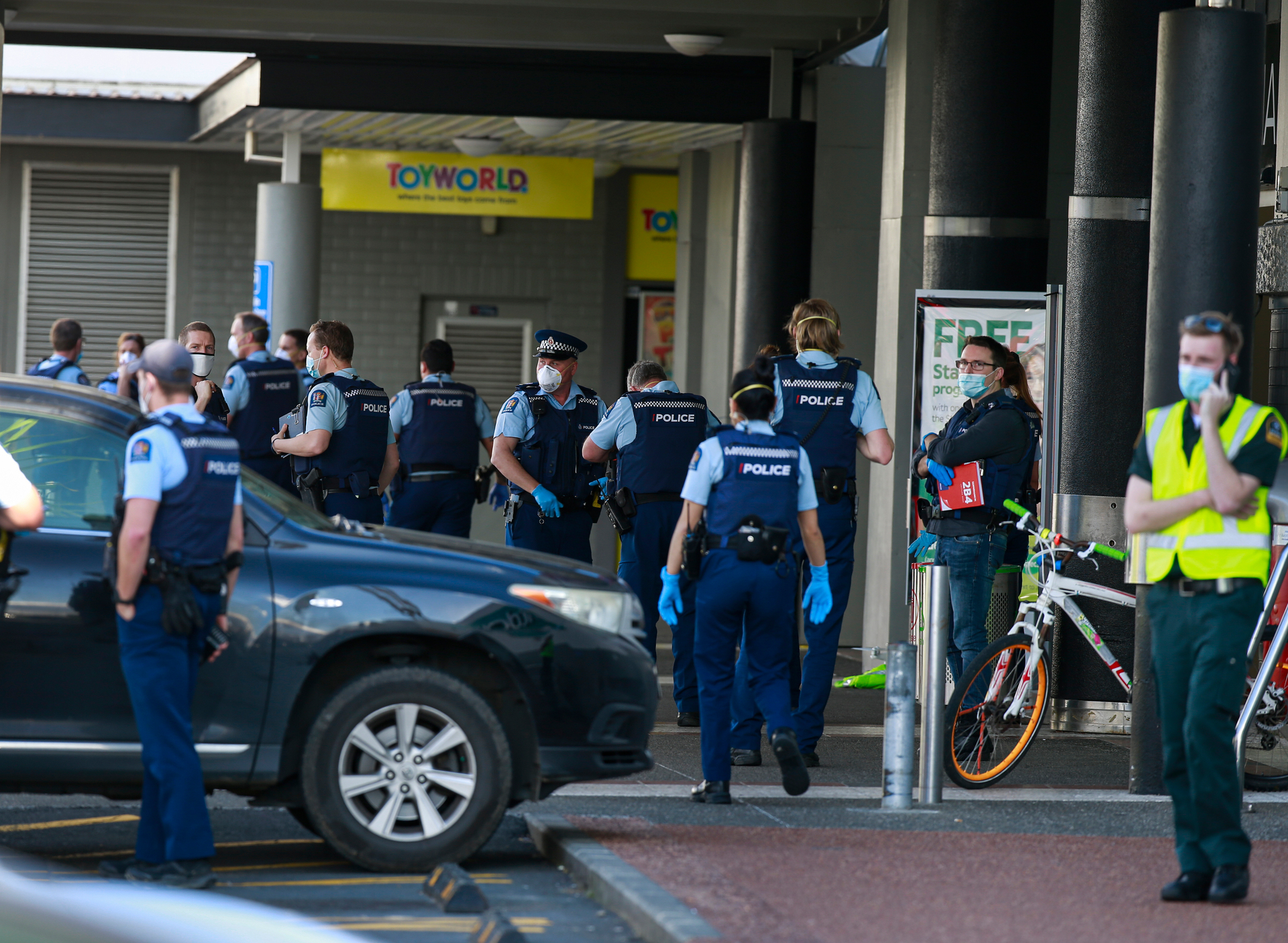 Police and ambulance staff at New Lynn's Countdown after yesterday's attack. Photo / Alex Burton