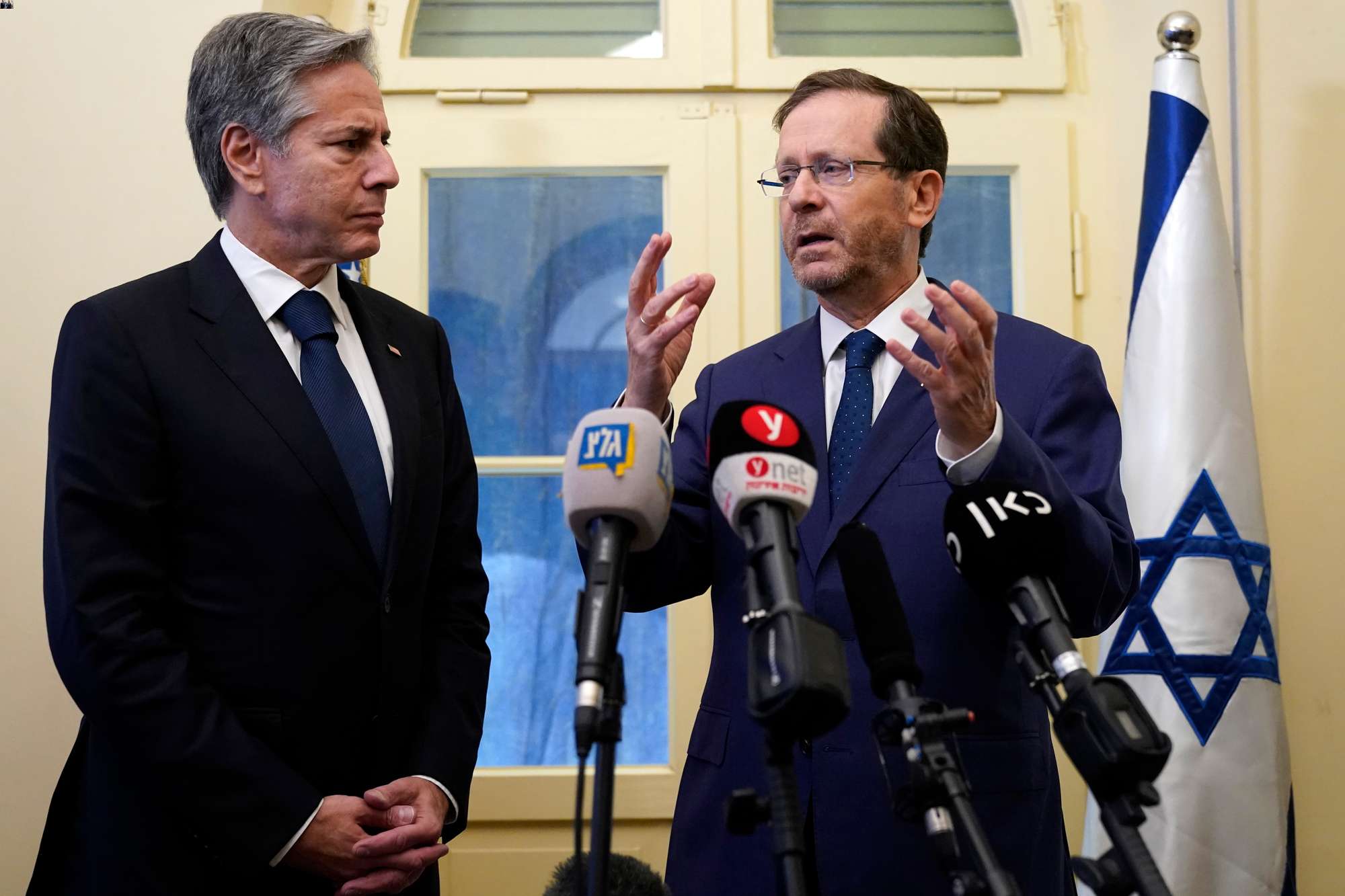 US Secretary of State Antony Blinken, left, and Israel's President Isaac Herzog make statements to the media in Tel Aviv on October 12. Photo / AP