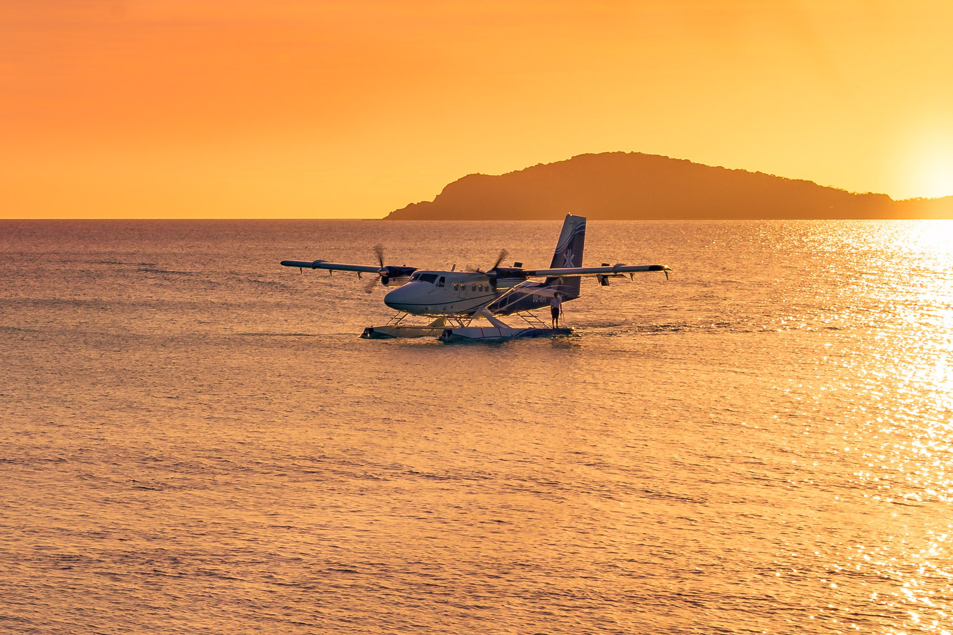Kokomo's private seaplane arriving at sunset. Photo / Supplied