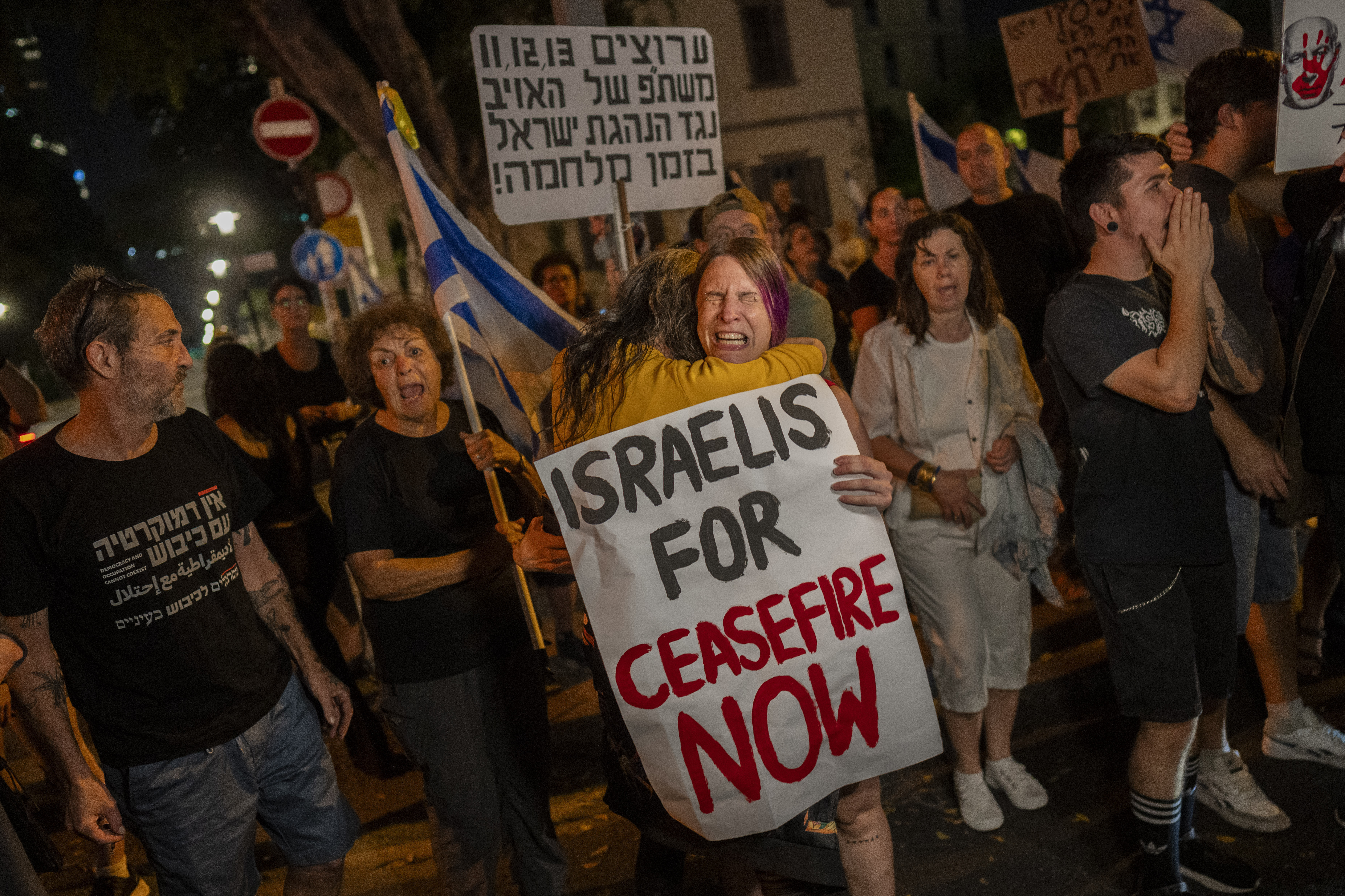 An Israeli woman calling for a ceasefire in the Gaza Strip is comforted by another protester after an argument with a right-wing Israeli in Tel Aviv, Israel on Saturday, November 4, 2023. AP Photo / Bernat Armangue