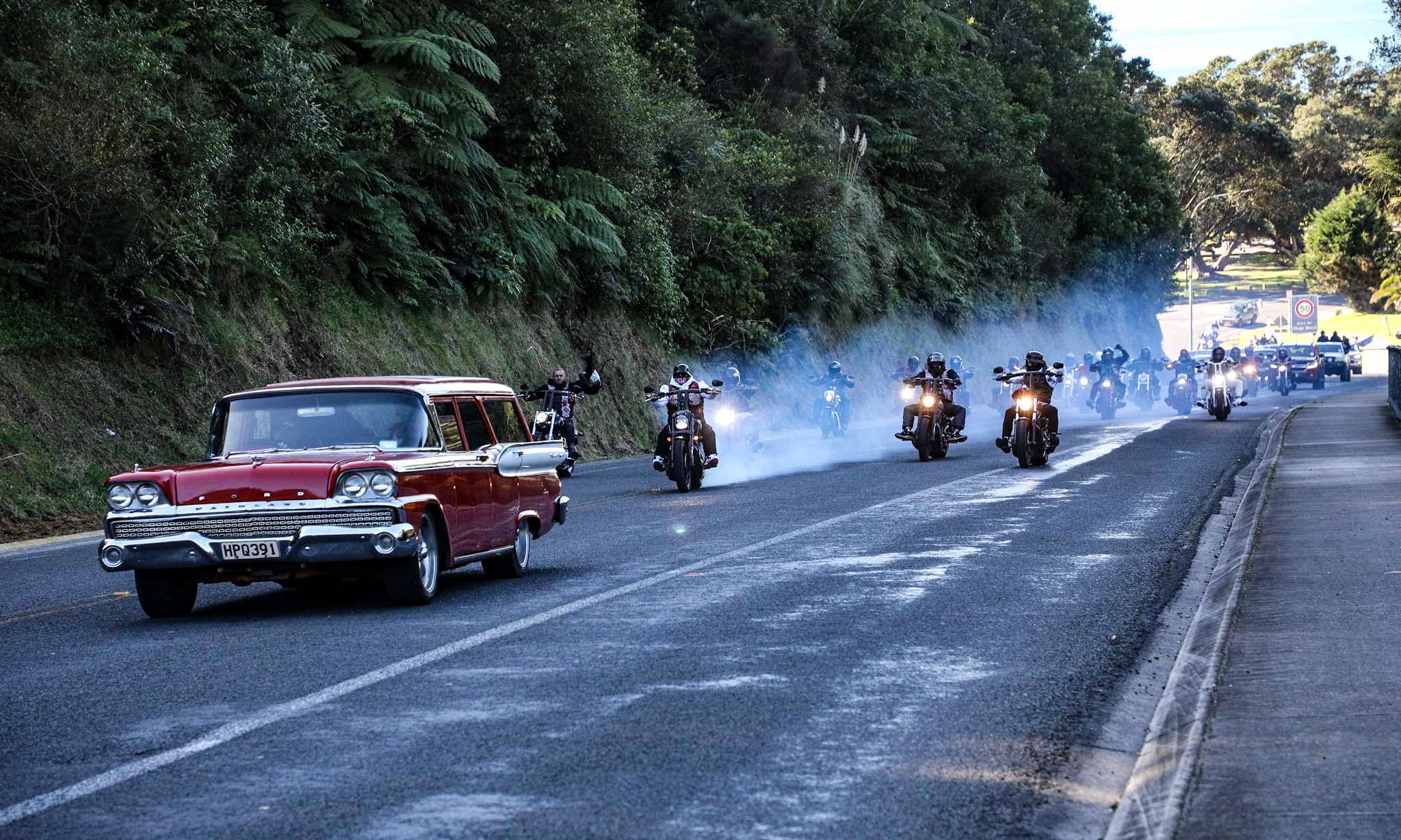 The hearse and motorcycle procession for the tangi. Photo / Andrew Warner
