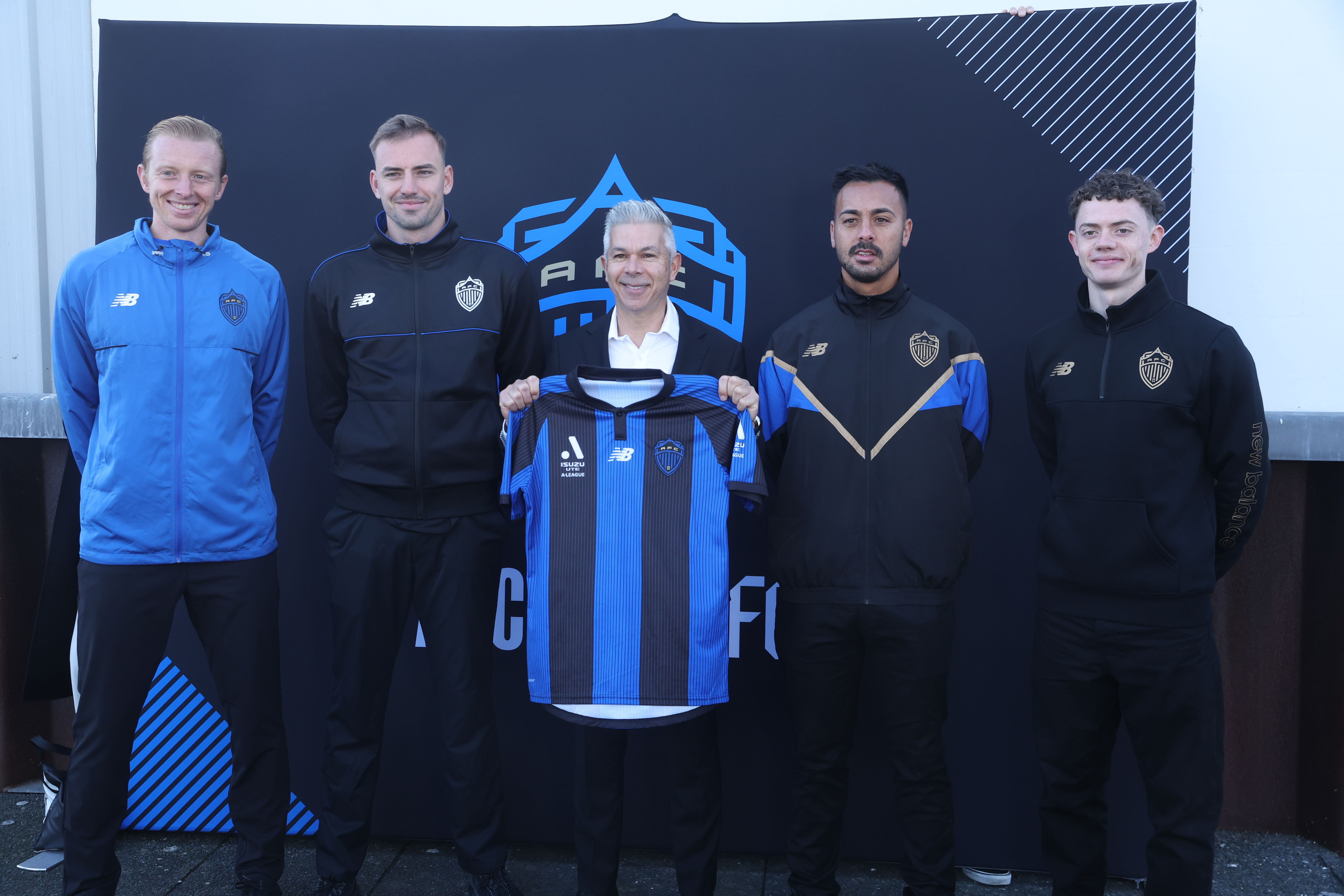 Auckland FC signings (from left) Francis De Vries, Michael Woud, head coach Steve Corica, Cameron Howieson and Jesse Randall. Photo / NZ Herald