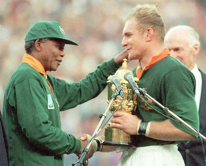 Nelson Mandela presents Francois Pienaar with the Rugby World Cup. Photo / Getty