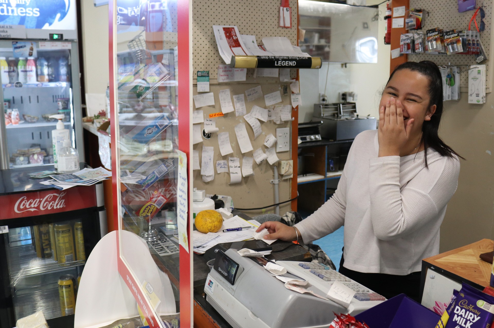 Service with a smile: Charlotte Chapman-Kete works in a store famous worldwide for its manaakitanga (care for others). Photo / Peter de Graaf 
