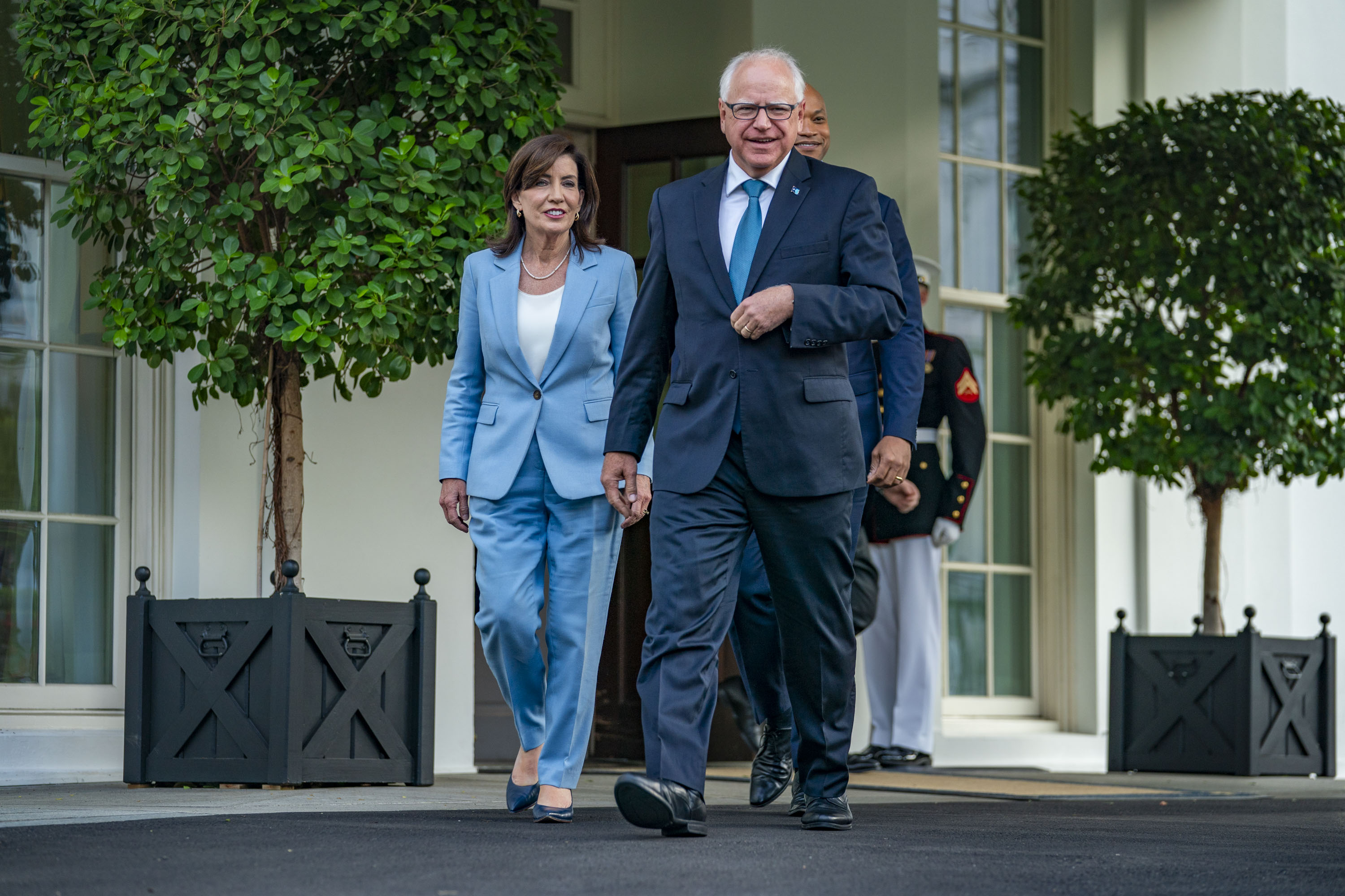 Kathy Hochul, Tim Walz and Wes Moore exit the White House on Wednesday following their meeting with President Biden. Photo / Allison Robbert/The Washington Post
