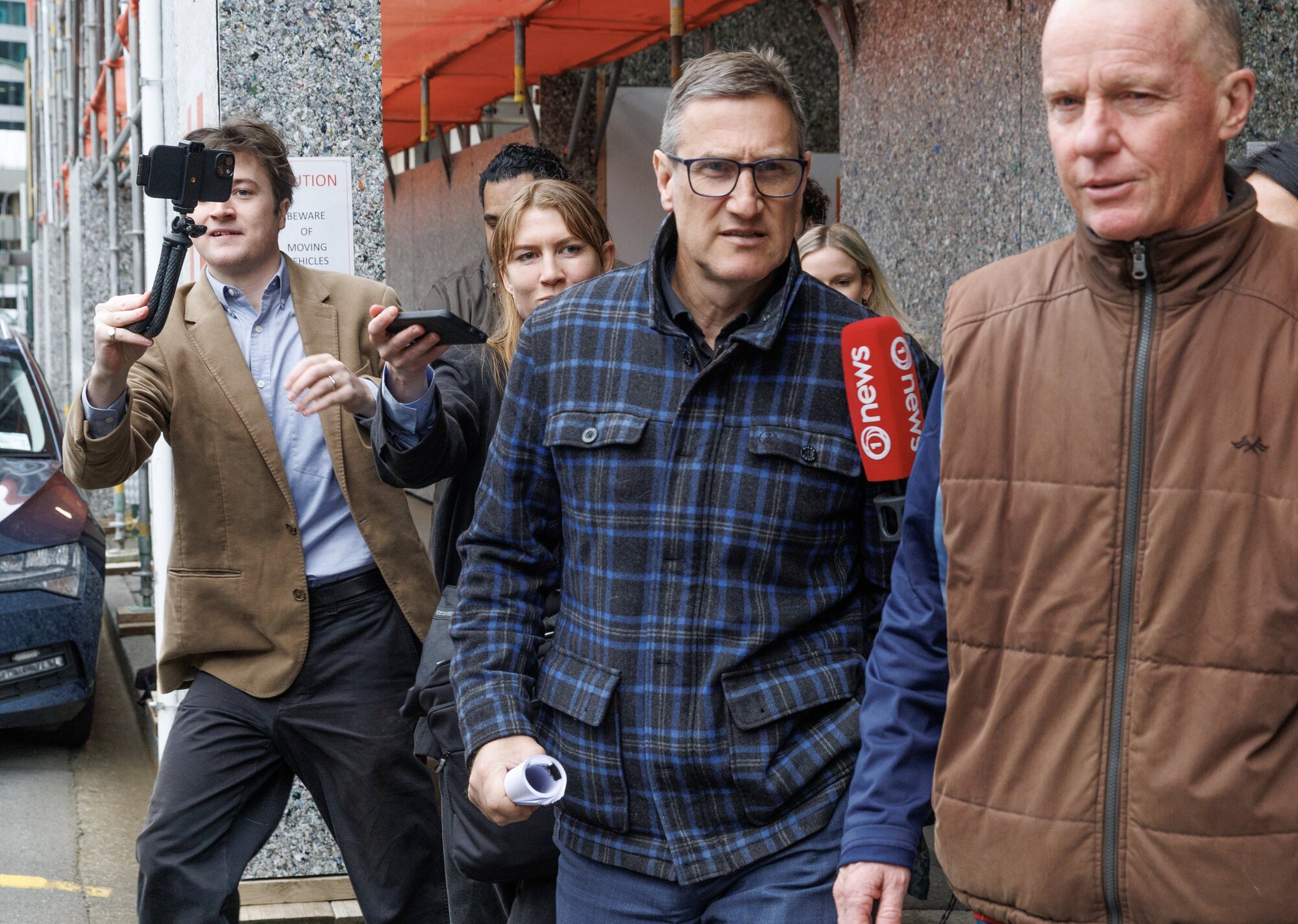 Jevon McSkimming is pursued by media as he leaves the Wellington District Court, Wellington, 04 August, 2025.  NZ Herald photograph by Mark Mitchell





 














