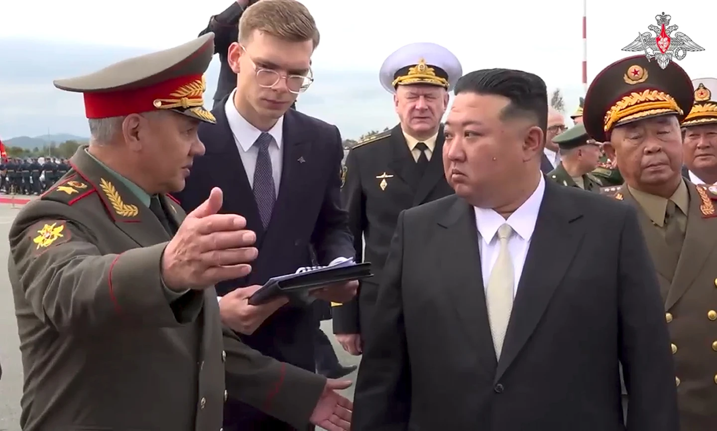 Russian Defence Minister Sergei Shoigu (left) and North Korea's leader Kim Jong Un in Vladivostok today. Photo / AP