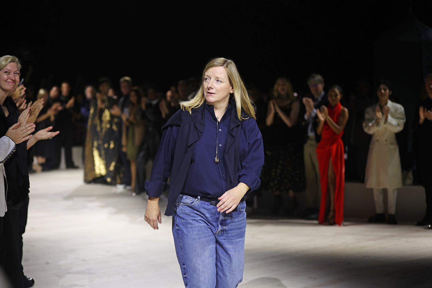 Designer Sarah Burton bows during her final show as creative director of Alexander McQueen. Photo / Getty Images