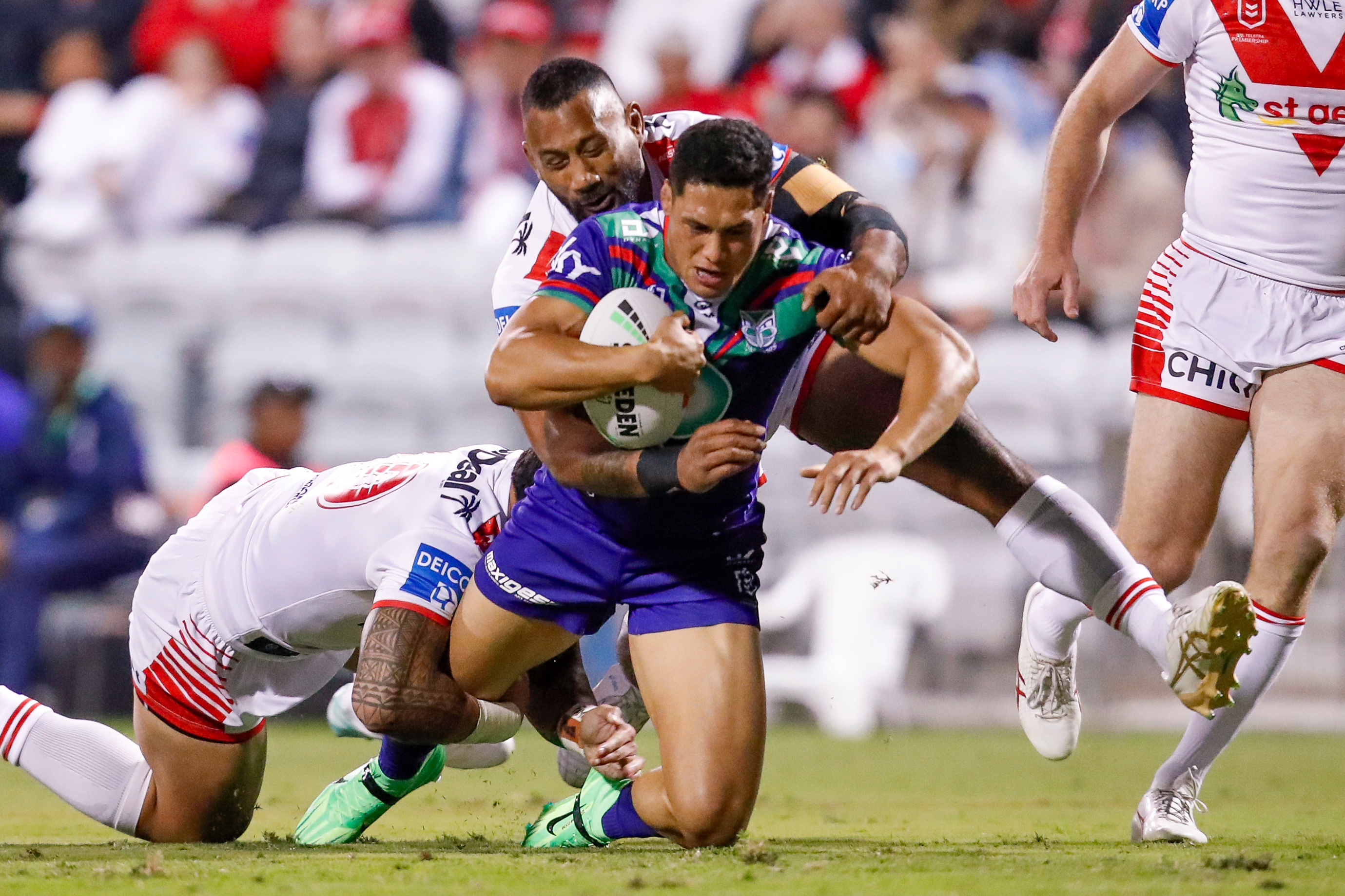 Roger Tuivasa-Sheck is tackled in his side's match against the Dragons. Photo / Photosport