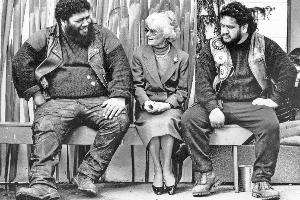 Lady Thea Muldoon with Black Power members after her husband's memorial service in 1992. Photo / Martin Hunter
