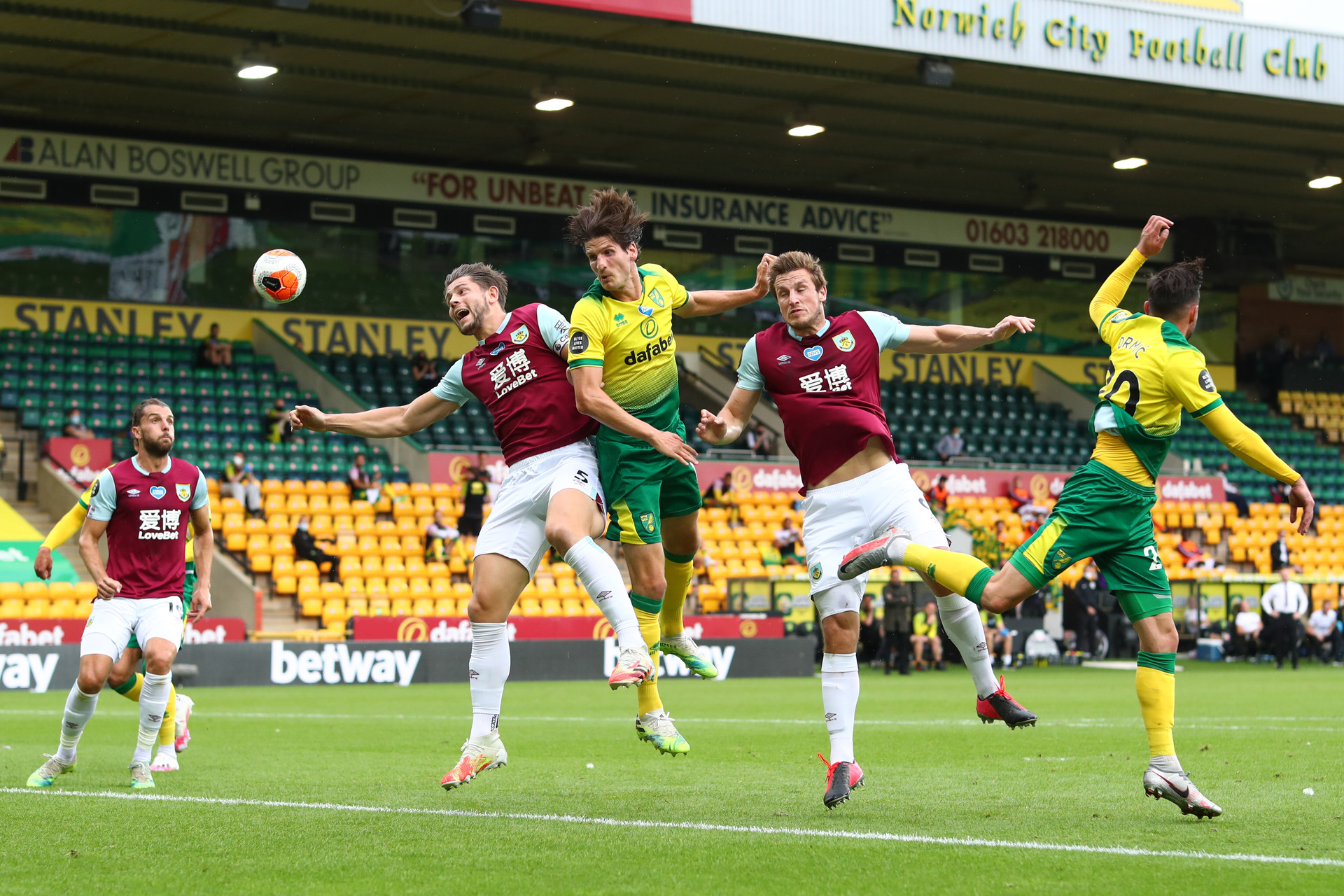 Timm Klose of Norwich City and Chris Wood of Burnley battle for a header during the Premier League match between Norwich City and Burnley FC. Photo / Getty Images.