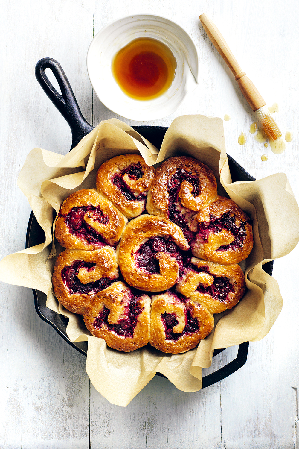 Serve these spiced scrolls hot with maple syrup. Photo / Supplied