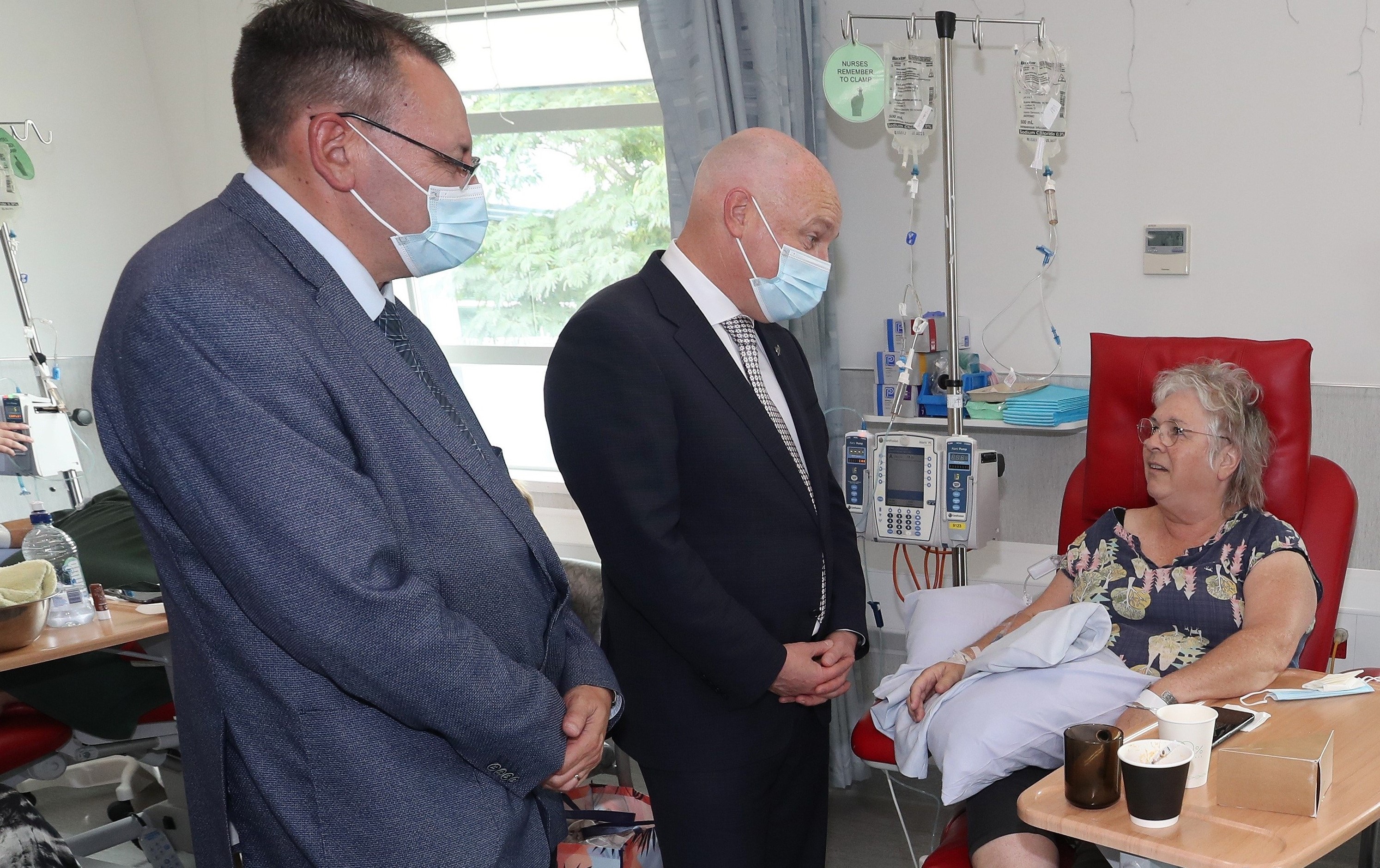 Health Minister Shane Reti and Prime Minister Christopher Luxon speak with cancer patient Vaimoana during a visit to Whangārei’s Jim Carney Centre in March. Health NZ says more Northland patients are now being treated within 31 days. Photo / Michael Cunningham.