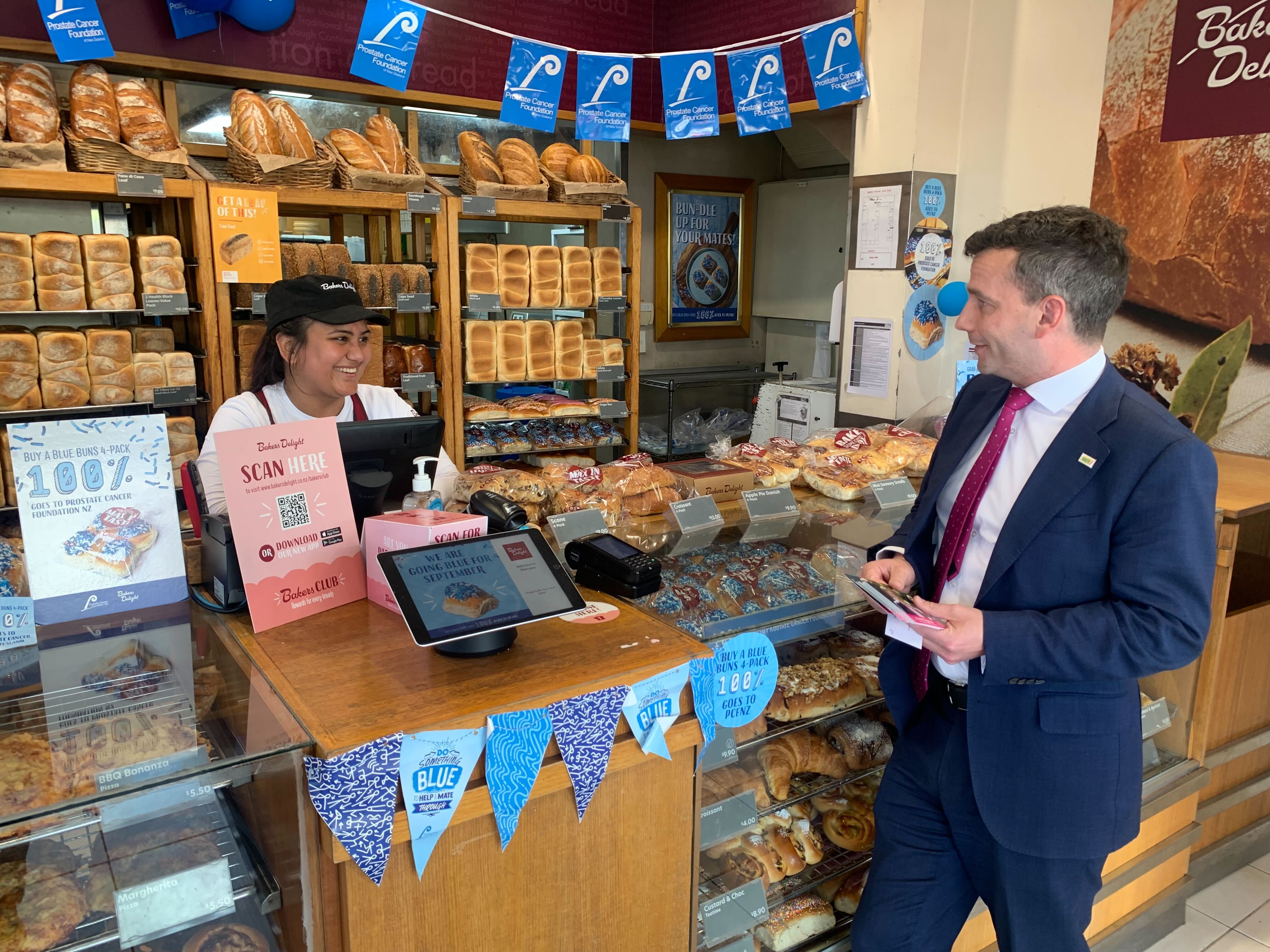 Act Party leader David Seymour speaks with a staffer at Bakers Delight during a  walkabout in Remuera, Auckland. Photo / Adam Pearse
