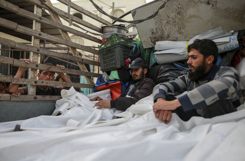 Palestinians mourn over the bodies of relatives killed in an Israeli airstrike, at a morgue in Rafah, Gaza Strip. Photo / AP