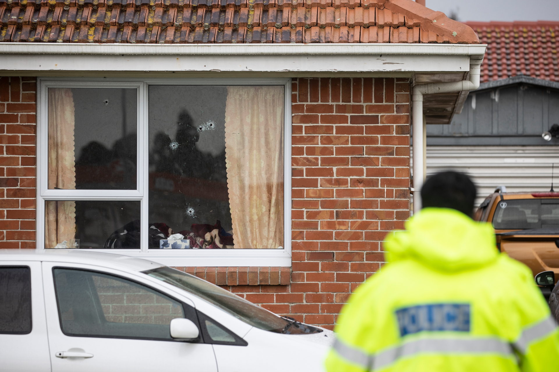 Bullet holes evident in the window of a house on Albert Rd whose occupants were mistakenly targeted recently. Photo / George Heard