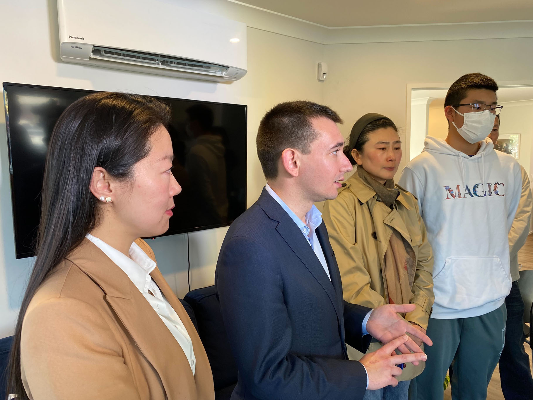 National MPs Simeon Brown (second left) and Nancy Lu (left) met with the 16-year-old schoolboy, Jason (right), who was attacked on an Auckland bus on Friday. Photo / Michael Craig