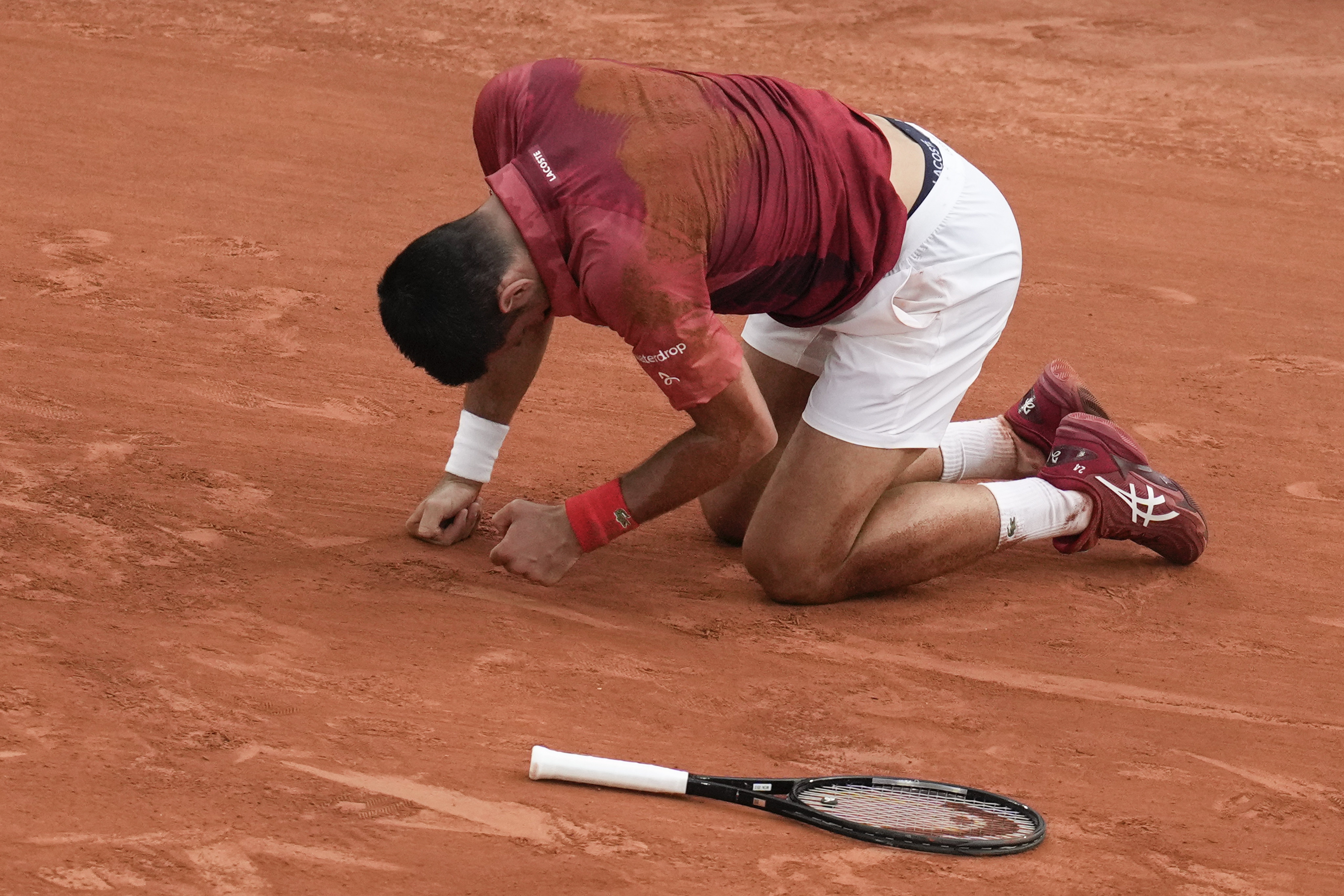 Novak Djokovic slipped and fell during the fourth round match of the French Open tennis tournament against Argentina's Francisco Cerundolo at the Roland Garros stadium in Paris. Photo / AP